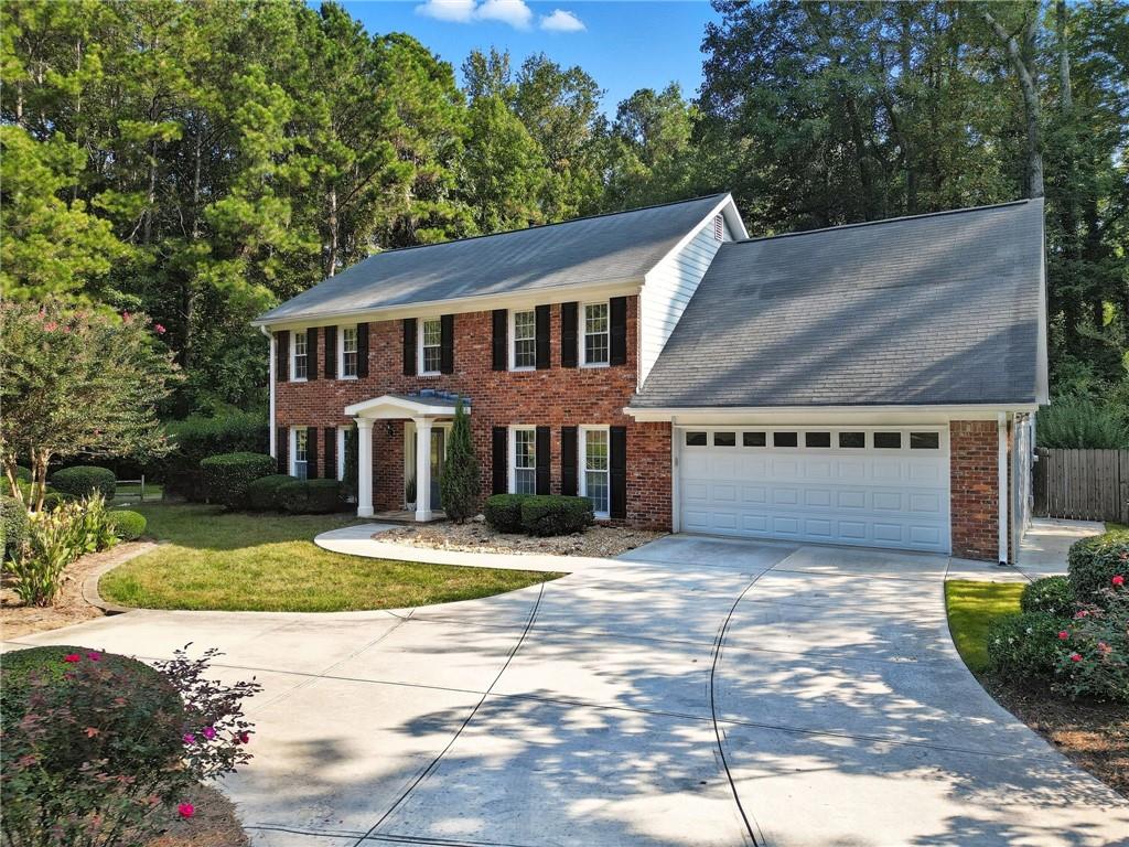 Welcome to Chimney Springs!
This beautifully landscaped brick-front home with Hardiplank siding offers 4 bedrooms with a large bonus room and 2.5 baths in one of East Cobb’s most sought-after communities.
Stepping into the foyer through a front portico, you are greeted with a traditional colonial style home with many renovations. This home was upgraded with hardwood floor throughout the house. The inviting family room with fireplace and built-ins flows seamlessly into a large sunroom filled with natural light—an ideal spot for morning coffee or evening relaxation. A convenient half bath completes the main floor.
The completely renovated kitchen boasts granite countertops, white cabinetry, stainless steel appliances, and a center island—perfect for everyday meals or entertaining.
Upstairs, discover all four bedrooms and two full baths. The spacious primary suite features an adjacent flex room—ideal as a nursery, office, or dressing area—along with a spa-like bath offering dual vanities, a separate tub and shower, and a generous walk-in closet with Elfa closet system
Step outside to your own private retreat: a flat, fenced backyard with manicured gardens, lush sod, and vibrant roses and hydrangeas providing year-round color. Whether it’s children playing, pets exploring, or evenings of al fresco dining, this yard was designed for memorable moments.
Life in Chimney Springs is unmatched. Take the adjacent path to enjoy a park-like surroundings and neighborhood amenities—swimming pool, clubhouse, eight lighted tennis and pickleball courts, a lake with biking and walking trails, playgrounds, basketball, and a large activity field.
Zoned for top-rated Pope High School, Hightower Trail Middle, and Tritt Elementary, this home offers a lifestyle of convenience, community, and charm. Just minutes from The Avenue East Cobb and Downtown Roswell, it truly blends vibrancy with retreat.
Welcome Home—to a place where every season brings new color, new memories, and new moments to treasure.