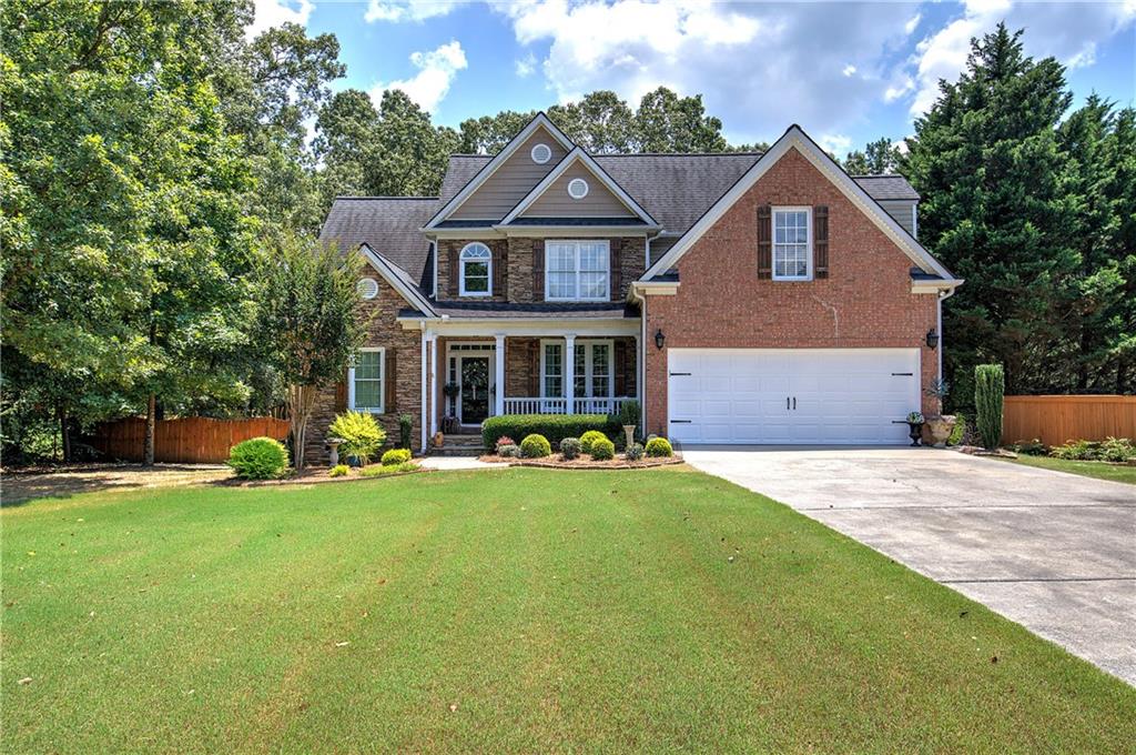 Welcome home to the stunning custom built home located in the sought after community Eagle Mountain Subdivision. The heart of the home is a gourmet kitchen with custom cabinetry and two pantries. Retreat to the large owner suite complete with a large walk-in closet with custom cabinetry and built-ins as well as a custom marble vanity, while three additional bedrooms offer comfort for family and guest. Walk outside to the large level fenced in backyard overlooking a 25x25 basketball court, with endless possibilities for use as well as a cottage style storage building with deck. This home also features custom millwork and details at every turn, with a cozy brick fireplace with gas logs. Both HVAC units have been recently replaced. Totaling over $20,000 as well as a new hot water tank. Beautiful well-maintained yard and upgraded landscape. Schedule a showing today!