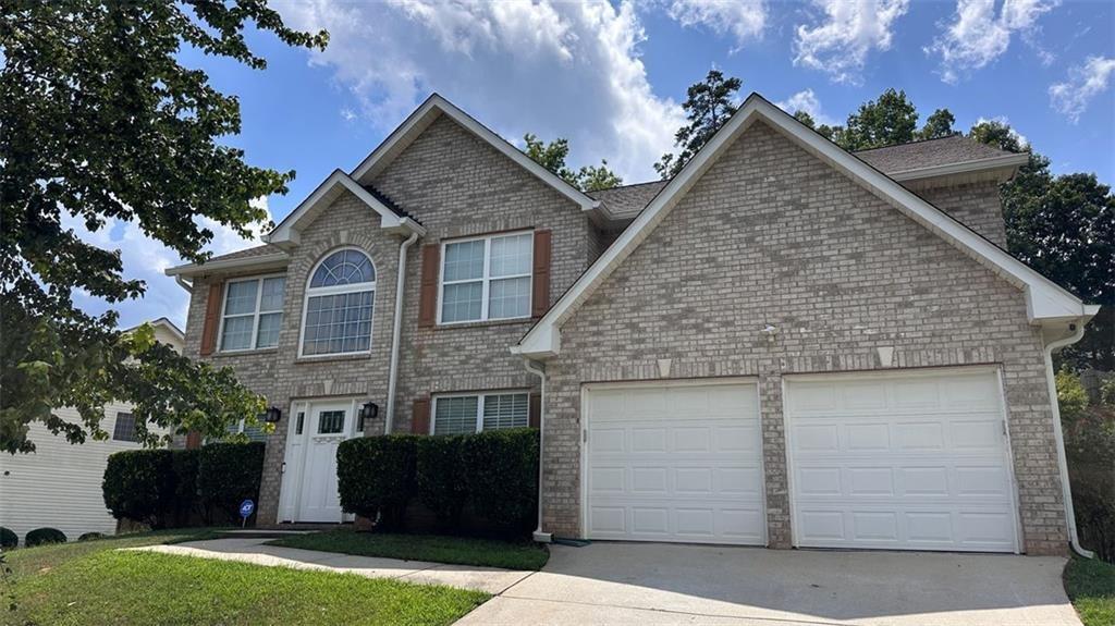 For rent $2999, 620 credit score required, applicant must make 2.5 x the rent! Welcome to 3258 Hunting Creek Pass, a breathtaking 5-bedroom, 3-bathroom sanctuary in Douglasville’s vibrant Anneewakee Trails community, where modern luxury and smart technology create an inviting haven. Step into an open-concept design awash in natural light, with luxury vinyl plank flooring flowing seamlessly throughout and sleek iron stair railings adding a bold accent. The chef’s kitchen dazzles with an oversized waterfall island, quartz countertops, ceiling-height soft-close cabinets, a farmhouse sink, a built-in bar with wine racks, and an upgraded pantry system, perfect for hosting unforgettable gatherings. The expansive master suite offers a cozy gas fireplace, a serene sitting area, and a spa-inspired bathroom boasting a freestanding soaking tub, frameless glass shower with rainfall showerhead, dual vanities, contemporary tilework, and a private toilet room. Additional bedrooms impress with walk-in closets and beautifully upgraded bathrooms featuring quartz and granite countertops, rainfall showers, waterfall faucets, and a vessel sink in the downstairs bath. Smart home conveniences like Nest thermostats, smoke and carbon monoxide detectors, smart locks, and smart garage door openers pair effortlessly with dimmable LED recessed lighting, custom 2” blinds, and remote-controlled ceiling fans for ultimate comfort. Recent upgrades, including a new roof, gutters, vinyl siding, fresh interior and exterior paint, insulated garage doors, and termite protection, ensure this home is move-in ready. Outside, a large fenced backyard with cedar-stained cap-top fencing and a custom oversized concrete patio beckons for barbecues or quiet evenings, while the brick-front exterior and Craftsman-style front door elevate curb appeal. Anneewakee Trails residents enjoy an Olympic-size pool with a lazy river and splash park, a state-of-the-art fitness center, renovated playground, tennis and basketball courts, and a scenic gazebo for relaxation. Just minutes from Sweetwater Creek State Park, Six Flags Over Georgia, Boundary Waters Aquatic Center, and Arbor Place Mall, this home offers serene suburban living with Atlanta just 25 miles away. Nestled in the esteemed Douglas County School District, this meticulously crafted gem is ready to call yours. Schedule your tour today! PROPERTY IS ELIGIBLE FOR SPECIAL 100% NO MI FINANCING!