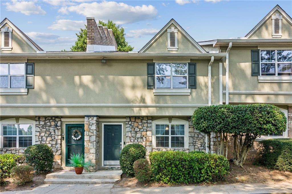 Townhouse convenient to 400, the Perimeter and Atlanta. Imagine being close to it all...This special opportunity offers a 2 bed / 2.5 bath roommate plan in a two-story building. This home features clean elements like stone, brick, stucco exterior, natural light pours into the rooms and kitchen, a fenced patio for enjoying the outdoors privately, convenient laundry closet on the main, an eat-in kitchen for 6 and living room on main. Both bedrooms are on the upper level with full bathrooms ensuite. There is a community pool and gated entrance.
Highlights of the townhouse include: newer LVP flooring - including the staircase, granite kitchen counters, stainless steel appliances, water heater approx. 4 years old, newer carpet, roof approx.. 4 years old. Carpet approx.. 4 years old.
1.1 miles to Abernathy Rd. and Publix. 6 miles to 400. 5 miles to 285. Restaurants and gas nearby.