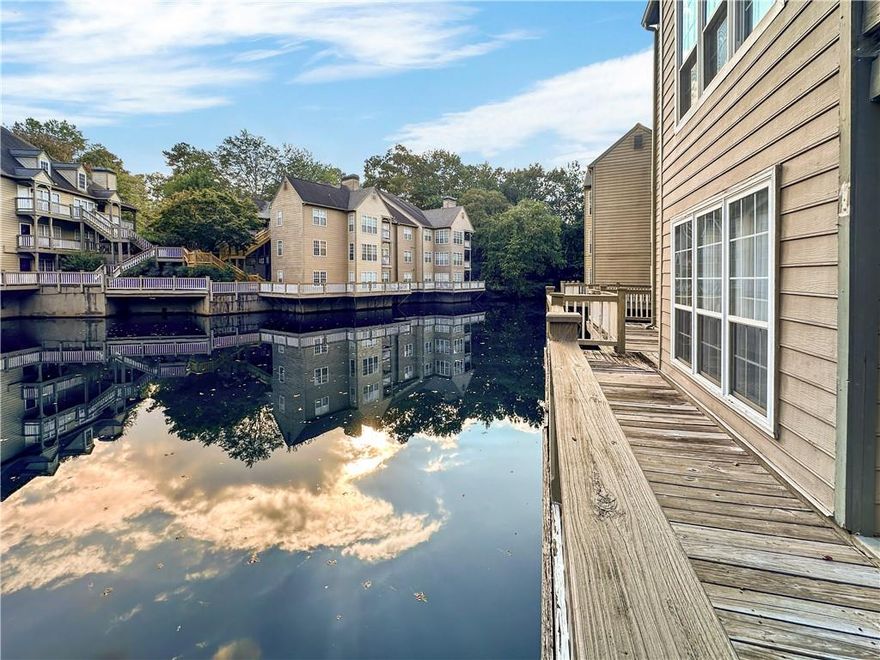 Experience the appeal of 606 Mill Pond Drive SE, a stylishly updated condominium in the sought-after Mill Pond Village community of Smyrna, Georgia. Renovated just a couple of years ago, this home offers modern touches including eco-friendly upgrades, luxury vinyl plank flooring, updated appliances, granite countertops, and refreshed bathrooms—making it a standout in the neighborhood.
Once showcased as a model home, this inviting residence features an open-concept layout with a cozy fireplace, a kitchen with solid-surface counters and a breakfast bar, and plenty of natural light throughout. The spacious primary suite includes a double vanity and a tub/shower combination, while the versatile second bedroom is ideal for guests or a home office. Unique to this home is its wrap-around deck—one of the few in the community—providing a serene outdoor retreat.
Residents of Mill Pond Village enjoy access to excellent amenities, including a fenced pool, tennis courts, and picturesque pond views. With its prime location near top-rated schools, shopping, dining, and major highways, this home blends modern comfort with everyday convenience.