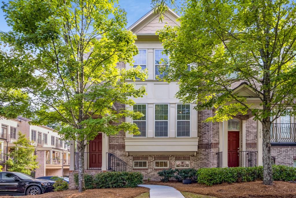 Located in the heart of Buckhead, this stunning end-unit townhome combines style, comfort, and unbeatable convenience. The open main level features a bright, spacious kitchen with stainless steel appliances, granite countertops, and hardwood floors, overlooking a welcoming dining area accompanied by a hallway powder room. A cozy fireplace anchors the living space, while French doors open to a brand new deck, perfect for morning coffee or evening gatherings. Upstairs, the expansive primary suite offers a serene retreat with ample closet space, while the oversized secondary bedroom boasts it's own walk-in closet and abundant natural light. A convenient laundry room with washer and dryer adds ease to everyday living. The terrace level includes french doors opening to a private office or guest bedroom with a full bath, offering flexibility to fit your lifestyle. Also enjoy a two-car garage plus an additional two-car parking pad. Resort-style amenities include a saltwater pool and private dog park, all within a gated community. Conveniently located to Lenox Square, top dining, and premier shopping, this home delivers the very best of Buckhead living.