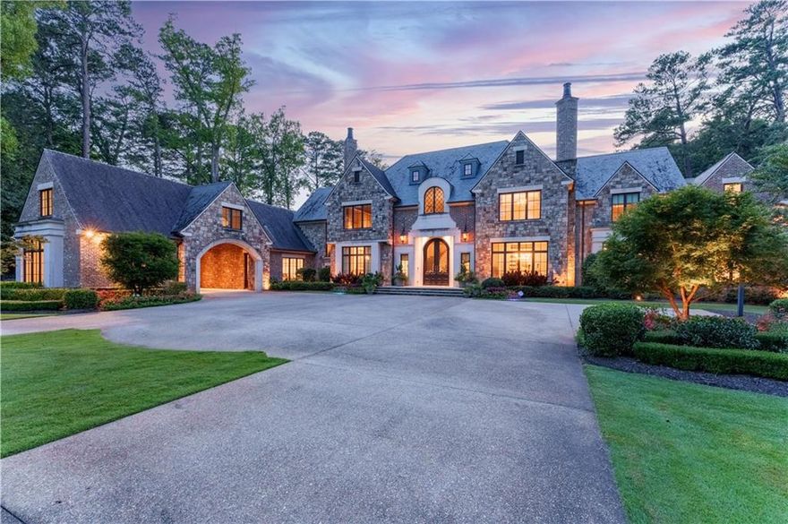 Tuxedo Park boasts many beautiful homes, but this estate stands out as truly exceptional. From the moment you enter the gates, the home commands your attention and will far surpass even the highest expectations.
Set on a sprawling 3.5-acre lot, this English manor-style house, and originally presented as the Designer Showhouse & Gardens, this spectacular estate has since been transformed into a warm, welcoming family home, with each stylish space infused with the family’s bespoke taste and spirited lifestyle.
BACKYARD - The impressive gated drive and motor court grant access to the stately home, but it’s the backyard that truly shines. Formal perfectly manicured gardens surround an infinity-edge pool, complemented by two fabulous pool houses.
POOLSIDE VILLAS - Each pool house boasts a unique set of amenities tailored to enhance fun, relaxation and any gathering. The main 2-story pool house presents a lively Palm Beach boutique hotel vibe providing comfortable accommodations for overnight guests, with private sleeping quarters, lounge seating and a gourmet kitchenette. The Entertainment Pavilion features a covered summer kitchen with expansive living & dining areas ensuring the perfect backdrop for unforgettable moments.
MAIN - Inside the main house you are treated to large wide-open yet functional spaces that are stylish and contemporary, while also feeling warm, inviting and livable. 


Beyond the dramatic 2-story foyer, study and formal dining room is the great room with spectacularly high floor-to-ceiling windows, and views of the pool and meticulously landscaped gardens.  The open chef’s kitchen features a breakfast room  with a unique sculptural wall treatment.  Even the spacious butler’s pantry is the perfect stop to enjoy a glass of chilled French rose.  
PRIMARY SUITE - The primary suite features a luxurious bedroom with dramatic sky-high vaulted ceilings and a fireplace. The opulent primary bath is accompanied by his and hers walk-in closets. Her closet mirrors a fine boutique with multiple custom shoe shelves, a lounge area and separate dressing room. It truly doesn’t get any better than this!
UPPER - This level includes 2 oversized sitting areas, 3 full bedroom suites, and another large bonus room. Over the 3-car garage you will find a second laundry room and a large warmly-lit studio space perfect for yoga and meditation.


TERRACE - A bar rivaling most private clubs occupies the end of the huge living space, with custom seating, lighting, and a disco ball to get the party started! It is rare to find a spa of this caliber in a private home with a traditional sauna, an infrared sauna, and steam shower. Recharge here after a workout in your private gym!
The home theater has oversized recliners and lounges (and a snack bar!) from which to enjoy the action on the massive screen in front of you. 
WINE LOUNGE - You must see to believe. Celebrate your collection under the custom lighting with space to breathe in the aromas and comfortable seating to  settle in to enjoy great conversation with friends over a bottle or two of your favorite red.  3800 Northside Drive is more than a spectacular home; it’s a lifestyle. Experience unparalleled luxury, comfort, and style in this exceptional Tuxedo Park estate.