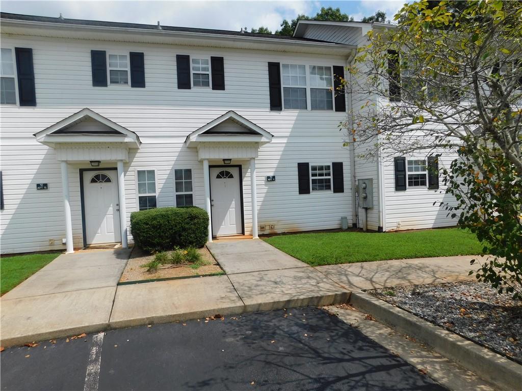 Discover an amazing townhome in the heart of Dahlonega, just two miles from the University of North Georgia and the bustling Dahlonega Town Square. This thoughtfully designed townhome features two spacious master suites, each with a full bath and walk-in closets, providing ample storage and comfort. An additional half bath is conveniently located on the main floor for guests. The generous layout includes a large kitchen equipped with modern appliances, a welcoming family room, and a separate dining room perfect for entertaining. Enjoy the convenience of washer and dryer hookups, as well as a refrigerator, dishwasher, and central heating and air conditioning. A monthly fee of $65 covers water, garbage, and lawn maintenance, ensuring hassle-free living. No pets allowed.