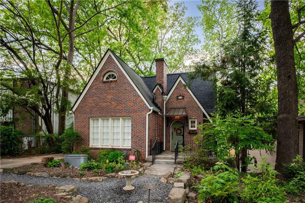 Welcome Home! This charming all-brick cottage boasts 3 spacious bedrooms on the main level, 2 updated baths, finished basement w/ 4th bedroom that can flex as office/den/playroom, back deck, & fenced-yard. Recently renovated by Stryant, the primary suite has it all & the basement includes office/laundry room, tons of storage, and loads of potential! Living room features vaulted cathedral ceilings and is overloaded with charm thanks to all the natural light, built-in shelves & bench, and the massive exposed brick fireplace. Large modern kitchen with stone counters, SS appliances, and breakfast bar is followed by the hallway to back deck or stairs to the basement. Wooded views out the back towards the headwaters of Hardee Creek, including a publicly owned communal greenspace that you have direct access to out the gate at the back of the yard. Centrally located in historic Kirkwood, short walk to Downtown Kirkwood, Bessie Branham Park, Pullman Yard, Kirkwood Urban Forest, Kirkwood Dog Park, Trolley Line Trail, and so much more! Brilliant!