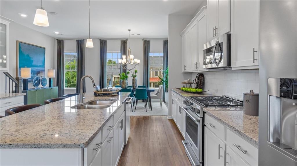 Hurry! Recently build luxurious, modern townhome in the heart of Historic Norcross. New appliances. Great location. Close to shops and restaurants, walkable to Lillian Park, minutes to I85. Open floor plan with kitchen, living and patio view with modern finishes. Elegant 3 bedrooms 3.5 baths, Featuring King sized two masters, Spacious bed rooms and attached full bath on all bedrooms. Beautiful white cabinets, wood stairs, stainless steel appliances, granite counter tops with nice backsplash, Granite Island with nice patio view, Tile in all baths. 2 car rear entry garage.
*note: some of the pictures are model only