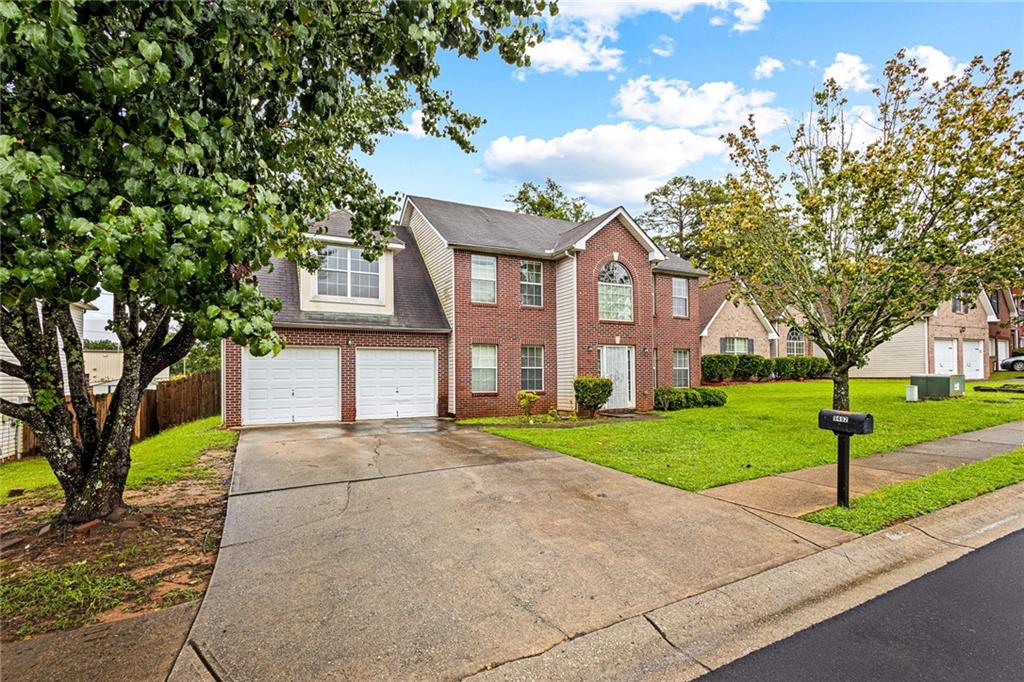 This home has been priced to reflect no recent updates, which makes it perfect for the buyer looking to put their own unique design touch into action. Nestled in the family-friendly neighborhood of The Manor subdivision in Jonesboro, this traditional 2-story brick-front home offers spacious, well-planned living. Built in 2005, it provides ample front and backyard. This home has a classic architectural/traditional style. Front foyer welcomes guests into a two-story entry with a dining room and flexible living/office space. The great room features a cozy fireplace with a seamless flow into the kitchen. The kitchen is equipped with ample cabinetry, breakfast area, and sight lines into the family room. There are four (4) sizable bedrooms upstairs, including a spacious primary suite. Suitable for those working in Atlanta but preferring suburban comfort with easy access to I-75. As evidenced by the pictures, packing has already begun. All reasonable offers will be considered.