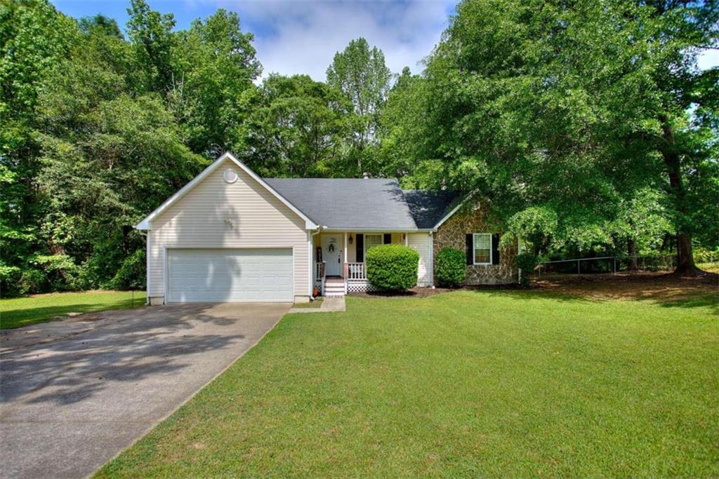Here it is!! Your New Home!! This Move-In ready Ranch home features hardwood floors and stone fireplace in the family room. Stainless Steel appliances with granite countertops makes this kitchen a gem. Large Owner's suite with separate tub and tile shower for relaxing. This home sits on a level yard and HUGE backyard for all the summer fun! Come view this home asap!!