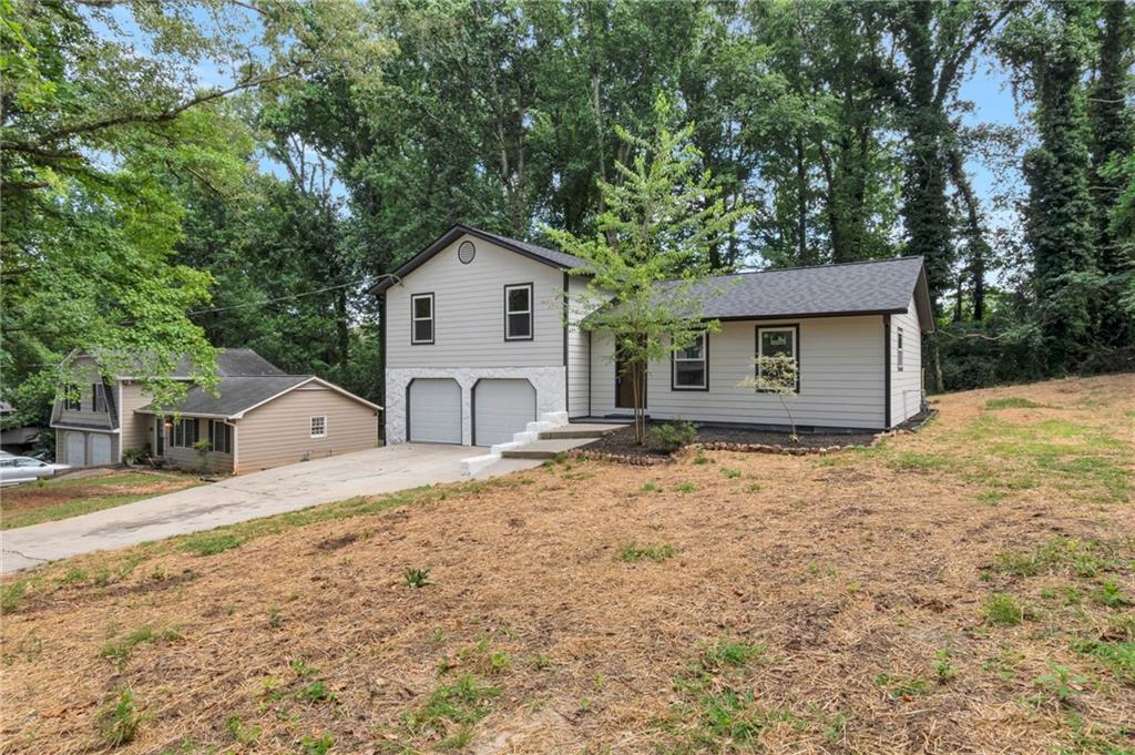 Fully renovated split-level home in peaceful Lawrenceville. Features updated kitchen with stainless steel appliances, laminate & tile flooring, private primary suite, and partially finished basement. Scenic, oversized lot with no HOA. Quiet, family-friendly neighborhood near top schools and transit. Perfect for first-time buyers! Seller is offering closing costs with full price offer!