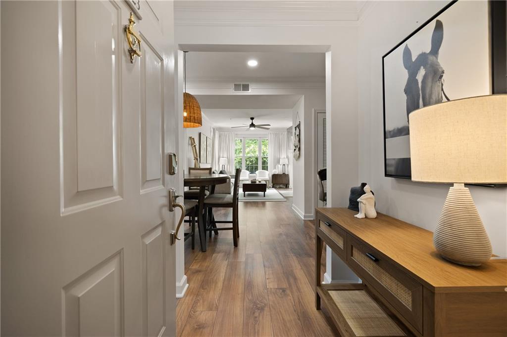 Tucked inside the gated, tree-lined community of Ashford Condominiums, this updated corner unit delivers a rare combination of peace, polish, and prime location.
Walkable to Dunwoody Village and just minutes from Perimeter Mall, the home offers unbeatable access to both I-285 and GA-400—giving you options in a city where traffic rarely cooperates. This particular unit sits quietly at the end of the hall, with stair access just outside the door and the elevator just down the corridor. The pool, gym, and covered parking? Right around the corner.
Inside, thoughtful updates include new stainless steel appliances, wide-plank LVP flooring, new dining area chandelier, ceiling fan in the living and all-new recessed lighting, new primary shower, smart lock + thermostat, and upgraded high speed internet connections. The current owners—only the second—have lovingly refreshed the space. The original owner, a single resident, barely used the guest suite, leaving those spaces virtually untouched.
A spacious covered balcony offers a private perch overlooking the trees—your own quiet escape within one of Dunwoody’s most connected pockets. Zoned to top-ranked elementary schools and surrounded by shops, dining, and convenience, this home offers a low-maintenance lifestyle in a high-demand location.
Whether you’re looking for your first place, a lock-and-leave landing pad, or simply a smarter move in a competitive market, this one stands out—for all the right reasons.