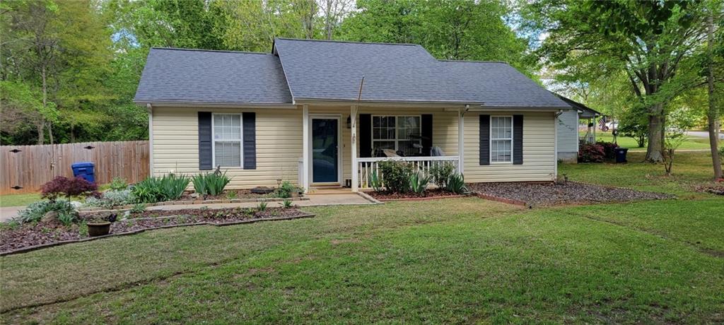 Discover this delightful home nestled in a highly sought-after area near downtown Winder. This corner lot gem features a welcoming front porch and a private fenced-in backyard, perfect for outdoor enjoyment and entertainment. Inside, you'll find granite countertops in the kitchen, complete with a backsplash, dishwasher, and glass-top range. The living room and kitchen boast durable LVP flooring, while the bedrooms are cozy with carpet and a convenient split floor plan. The master bedroom has a full bath with vanity and granite countertops. The exterior offers a relaxing front porch while in the back you find a patio and a handy storage shed for all your needs. This beautifully located home is ready for you to make it yours today