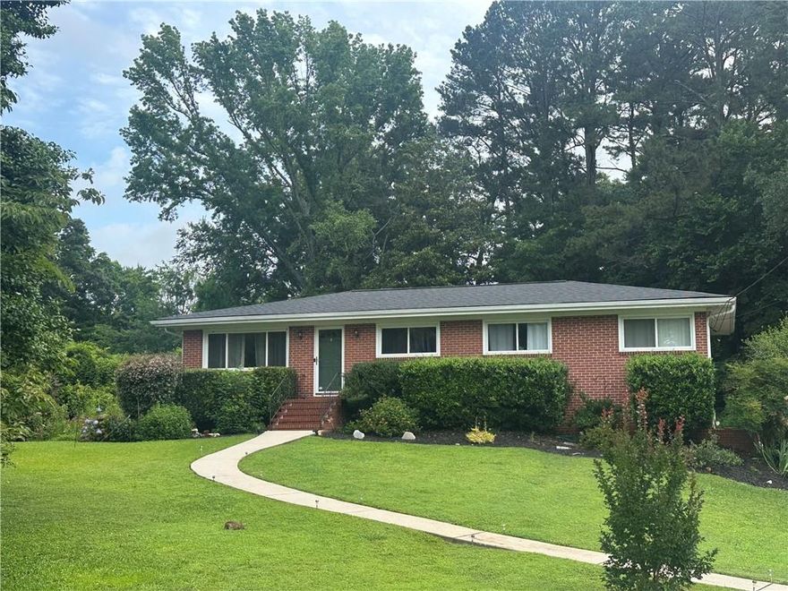 MARIETTA SQUARE: Amazing opportunity to make your mid-century dreams come true! The heavy lifting has been done: BRAND NEW ARCHITECTURAL SHINGLE ROOF (fully replaced on June 10th), new HVAC, new Trex deck, fresh backyard sod like a golf course, updated plumbing, solid roof, original hardwoods in beautiful condition, charming original bathroom tile, wood cabinetry and neutral, solid surface countertops in the kitchen, PLUS an unfished basement sitting at the ready to build additional equity. Chilling quietly on a great little side street, just a short stroll or roll to everything that makes the Marietta Square lifestyle a thing of envy, sits this 1956 GEM. All you need to take it to the next level is imagination! (Or simply to schedule the movers, because this little rock star is READY to ROLL as is!) Nothing beats a 50s ranch for ease of renovation and ongoing maintenance, and nothing beats entertaining friends and family on your sweeping back deck and hitting the sidewalk for a Michelin Star meal, sampling unique cocktails, perusing the work of local artists, enjoying free concerts, soaking up outstanding plays, and delighting in memory-making festivals. If your adventuring includes hiking and biking, the M2R Trail is just a couple of blocks away, taking you to Kennesaw Mountain Battlefield Park in one direction, and the Silver Comet Trail and Chattahoochee River in the other. Got a boo-boo? You can even hit the bricks to Kennestone Hospital! The Big Chicken, Six Flags White Water, Andretti Speedway, Kennesaw State University, I-75 and -575 are minutes away as well. 3 bedrooms, 2 full baths, and a world of opportunity are just waiting for you to claim them. Come see how great Marietta Square living can be, right here on Talcott Circle. We’ll leave the light on for you.