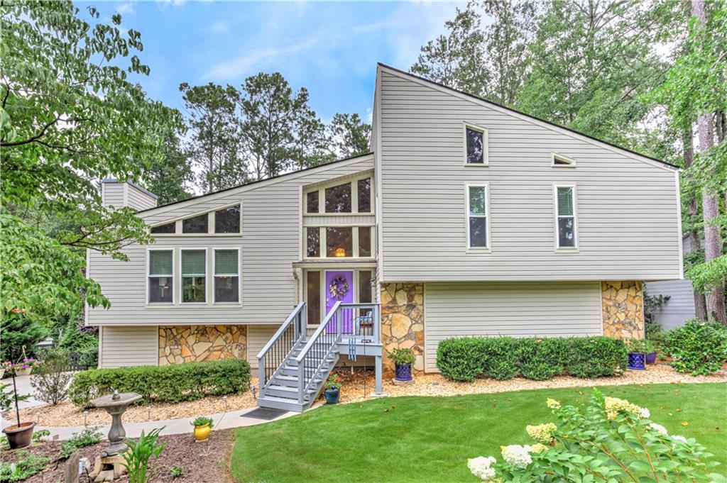 Rare find in sought after Liberty Ridge which is walkable to Pope High School. This home is immaculate with upgrades throughout. Every detail of this home has been meticulously maintained. The front and backyard are private and landscaped with details that make this home standout pebble paths, pavers, flowering bushes throughout the entire yard front and back. The upgrade list is extensive leaving the new buyer with nothing to do but unpack boxes and get ready to enjoy their new home. 17 windows with energy efficient double pane windows, all plumbing waterlines replaced with PEX piping, 3-year-old 50-year shingled roof, new concrete driveway smooth with not a crack in sight, fresh new paint kitchen, dining room, and stairway to the lower level, all new Kohler low flow water toilets, newly installed dishwasher, 3/4 inch red oak hardwood flooring, LVP flooring in kitchen and front entrance, Trex decking on rear deck and deck stairs, new front porch with solar lights, garage floor finished with Rustoleum paint, new Owner's bath floor tile and double sink marble countertops, mirrors and lightening, hallway bath flooring is renovated along with a renovated cabinet sink, new anti-clog gutters with 4" downspout, keyless front door entry plus ring doorbell/cam, and whole house vent/duct cleaning. Storage shed to store all of your outdoor equipment which will keep the garage better organized. You never find this many high-quality upgrades that will last for many years to come. Don't miss this opportunity to tour this home that is close to all East Cobb has to offer top ranked public and private schools, shopping, dining, entertainment, parks, Chattahoochee River Walk, Close to I-75 and GA 400.