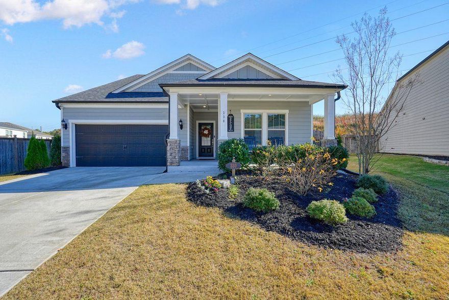 Welcome to 330 Davis Lane—a bright, stylish 4 bed / 3 bath 1½-story ranch that mixes modern charm with that “feel-good” flow everyone is looking for. Built in 2020 and beautifully maintained, this 2,535-sq-ft home offers the perfect blend of comfort, space, and personality.
Step inside and you’re greeted by an open-concept layout that invites you to breathe, relax, and start imagining life here. The primary bedroom on the main level makes everyday living a breeze, while additional bedrooms and bonus space upstairs are perfect for guests, hobbies, or that home office you’ve been dreaming about.
But let’s talk about the showstopper—the kitchen.
With sleek shaker cabinets, stone countertops, a large island, and a stylish backsplash tying the whole look together, this space is begging for potlucks, pancake mornings, and late-night conversations. The kitchen bar keeps everyone close to the action, while the layout makes hosting effortless.
The living room brings the cozy with a charming fireplace, ideal for unwinding after a long day or creating your next movie-night ritual. Tray ceilings in the primary bedroom add an extra touch of elegance, and the welcoming front porch is practically made for coffee sipping, neighbor waving, and enjoying those perfect Georgia evenings.
And the location? Perfection.
You’re just 10 minutes from Downtown Woodstock—hello, great food, live music, and small-town charm! Plus, Dupree Park is right around the corner for nature walks, playtime, and weekend fun.
 Modern comfort, warm character, and an unbeatable location—this Woodstock gem is one you’ll definitely want to check out!