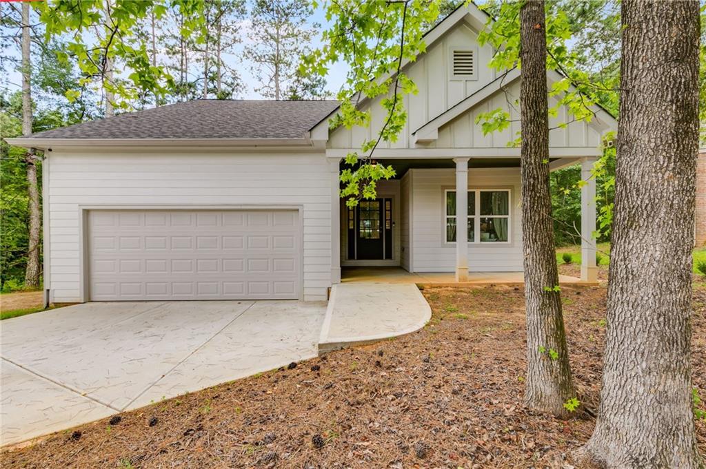 Welcome to 3350 Villa Lane, a beautifully crafted 3-bedroom, 3-bathroom ranch-style home nestled in the serene cul-de-sac of Glen Villa Estates, Douglasville, GA. Built in 2024, this 1,898 sq ft residence offers modern living with thoughtful design and quality finishes throughout.
Key Features:
Open Concept Living: The spacious great room boasts vaulted ceilings and a cozy fireplace, creating a warm and inviting atmosphere.
Gourmet Kitchen: The kitchen is equipped with a full appliance package, a walk-in pantry, and an island, perfect for meal preparation and entertaining.
Private Primary Suite: Located on the main floor, the primary bedroom includes an ensuite bathroom with dual vanities and a walk-in closet.
Outdoor Living: Enjoy the outdoors from the oversized covered deck or relax on the large covered front porch, ideal for morning coffee or evening gatherings.
Convenient Laundry: The main-level laundry room adds to the home's functional layout.
Location Highlights:
Situated less than 2 miles from local shopping, schools, and the newly constructed Great Point Studios and Lions Gate Studios, this home offers both tranquility and convenience.
Don't miss the opportunity to own this stunning new home in a sought-after neighborhood. Schedule a showing today and experience all that 3350 Villa Lane has to offer!