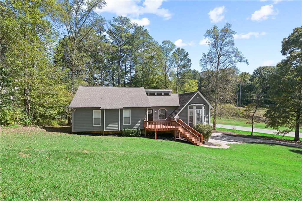 Welcome to 4909 Millen Drive, in the heart of the quickly growing city of Mableton, this is a beautifully maintained and thoughtfully updated home that offers space, convenience, and incredible potential for investment income in a prime location.
Just minutes away from local shopping, dining, and the scenic Heritage Park Trail and Silver Comet Bike Trail, about 10 minutes to Smyrna Market village and 15-20 minutes to Truist park, this home provides the perfect balance of peaceful suburban living with easy access to modern amenities and outdoor recreation.
Inside, you'll find a spacious and open layout perfected with luxury vinyl plank flooring and beamed ceilings, ideal for entertaining and everyday living. A renovated kitchen with beautiful white cabinetry, granite counter tops, stylish exhaust vent, and eat-in bar area, it will surely impress anybody who comes in! One of the standout features of the home is the bright and airy loft, offering a flexible space that can be used as a home office, creative studio, or additional living area.
The newly renovated basement includes a full in-law suite with its own kitchen, bathroom, and private entrance, making it perfect for extended family, guests, or as a source of rental income. Whether you're looking to offset your mortgage by renting the suite or need a comfortable space for multigenerational living, this setup adds both value and versatility.
The outdoor space offers plenty of room to relax, garden, or entertain, and the location puts you within close reach of everything you need while still enjoying the benefits of nearby nature trails.
4909 Millen Drive is a unique opportunity to own a home that not only fits your lifestyle, but also supports your financial goals. Whether you're a homeowner looking for flexible living options or an investor seeking income potential, this property checks all the boxes.