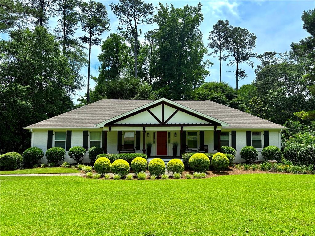 YOU HAVE JUST FOUND YOUR NEEDLE IN A HAYSTACK! A Rare Opportunity to Own a Ranch in East Cobb’s Premier Walton High District!**Your search ends here at 3548 Liberty Lane, a beautifully painted three-sided brick ranch located in one of Marietta’s most coveted swim/tennis communities. Just a short walk to Walton High and Dodgen Middle, this 4BR/2.5BA home offers space, flexibility, and unbeatable convenience.**Freshly updated in many ways, yet still offering the perfect canvas for your personal touches, this home features a large covered front porch that sets a warm, inviting tone. Inside, the sunlit layout is a designer’s dream: open-concept kitchen with vaulted ceiling and fireplace, spacious living room with adjacent office/flex space, and main-level bedrooms including a primary suite with attached bath.
**The recently added laundry/mudroom includes a large ceramic sink, half bath, and drop zone—ideal for busy households. The finished terrace level offers a generous family room with built-ins, a private bedroom retreat, two versatile rooms (perfect for offices, gym, or studio), secondary laundry hookups, and expansive unfinished storage areas.**Enjoy the outdoors with a fenced backyard, entertaining deck, firepit, and charming greenhouse—perfect for garden enthusiasts. You will be thrilled to see numerous fruit trees & berry bushes!**Attached 2-car garage plus extra parking pad for 3 additional vehicles.**Minutes to top-tier shopping, dining, parks, and medical care. Full home warranty included for peace of mind.**Welcome home to Liberty Lane—just in time for the new school year!