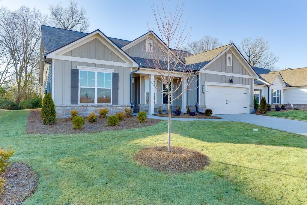 Gorgeous home with lots of upgrades & set in a beautiful tranquil setting. Welcome to Your Dream Home Community!!! Discover a rare opportunity to join an exclusive neighborhood of just 130 thoughtfully designed homes. HOA mows the lawn giving you more time to enjoy the amenities & make new friends.
This 2-bedroom, 2.5-bathroom ranch home offers charming details, thoughtful design, and serene surroundings, making it an ideal retreat.
Key Features:
• Charming Exterior:
• Stone water table line and a welcoming covered front porch.
• Flexible Layout:
• Includes a separate flex room, perfect for a formal dining room or home office.
• Stylish Kitchen:
• Light Grey cabinets with quartz countertops.
• Spacious island with decorative legs and a farmhouse sink.
• Flows seamlessly into the family room for open-concept living.
• Cozy Family Room:
• Features a beautiful stone fireplace flanked by built-in cabinets with shelves above, adding both charm and functionality.
• Primary Suite Retreat:
• Trey ceiling adds elegance.
• Luxurious bathroom includes:
• A super shower with 12x24 tiled walls and bathroom floors.
• Quartz countertops, comfort-height toilet, linen closet, and a walk-in closet.
• Second Suite:
• Equally impressive with:
• Tiled shower walls, quartz countertops, comfort-height toilet, linen closet, and a walk-in closet.
• Additional Features:
• Built-in drop zone in the mud area for added convenience.
• Wide plank flooring in key living spaces, including the foyer, kitchen, breakfast room, family room, and flex room.
• Outdoor Oasis:
• Covered back patio offering peaceful views of nature, perfect for relaxation and ya level backyard that is perfect for your 4 legged friends.
This charming ranch home combines modern finishes with cozy comfort, providing the perfect setting for both everyday living and peaceful retreats.
Gorgeous quality built homes by Three Rivers Homes. Builder Incentive is $7,500.00 towards new upgrades OR $7,500.00 towards closing cost. This is tied to a full price cash contract or when using the preferred lender.
Northminster Farms is a beautiful active 55 + lifestyle community. With the combination of amenities like pickleball courts, a clubhouse, a junior Olympic pool, green spaces, and a generous 2.5 miles of sidewalks creates a perfect environment for both relaxation and activity. With only 130 homes, it will have a close-knit, friendly atmosphere, ideal for forming connections and enjoying an active social life
