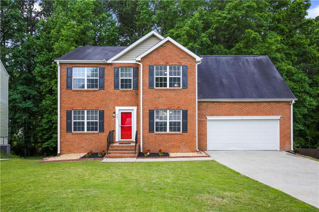 FULLY REMODELED brick front home with custom renovations, modern taste throughout and a fully finished basement; this 5 bed/3.5 bath landscaped home in excellent Kennesaw school district is ready for you to move in! With over $100,000 in RENOVATIONS, this unique property has it all! With a beautiful curve appeal and leveled front yard, this home sits on a quiet street ending on a cul-de-sac. Be welcomed by the red front door and you will be wowed by the modern feel of the foyer and gorgeous NEW FLOORS throughout the entire main and upper levels. To the right, get the first impression of a beautifully remodeled home, entering the large dining room with ACCENT WALL and MODERN black/brass light fixtures you will see throughout the main level with a touch of sophistication. To the left, go through the double doors into a private BONUS ROOM, perfect for an office or musical room. Continue discovering the home into the OPEN SPACE area with the kitchen, family room and breakfast area. The CUSTOM DESIGNED KITCHEN is every chef’s dream, with QUARTZ Carrara-style countertops, WHITE shaker cabinets including spice & trash cabinets, VENT HOOD surrounded by FLOATING WOOD SHELVES and gorgeous backsplash tile to ceiling, RECESSED LIGHTS & PENDANT light fixtures, STAINLESS STEEL appliances & large SITTING peninsula, perfect for entertaining while cooking delicious meals. Next to it is the great living/family room with cozy fireplace and accent wall. In front of the seating kitchen, you also have the space for a breakfast area, which has glass doors leading to an ample renovated DOUBLE DECK, perfect for grilling at the same level as you entertain your family and friends. The deck has been renovated with new handrails and NEW STAIRS connecting the upper and lower deck. To further enjoy the outdoor experience of this home, step into the side patio as a great FIREPIT relaxing area! Upstairs you will find 4 bedrooms starting with the OVERSIZED MASTER room, renovated MASTER BATH & walking closet. Enjoy the Master Bath SPA-feel of a CUSTOM-MADE WOOD DOUBLE FLOATING VANITY, LED MIRRORS, BLUETOOTH SPEAKER with daylight/nightlight effects, gorgeous standing GLASS SHOWER SPA-like with rain shower head & hand-held shower, separate soaking tub, all infused with natural daylight. There are three additional secondary rooms, all with ceiling fans for extra comfort, sharing the modernly renovated full bath with shower/tub combo & SPA-shower head, plus custom-made wood floating vanity & black fixtures. Laundry area is also upstairs, close to the bedrooms and has an ample storage area. And there is MORE! This home has a fully FINISHED DAYLIGHT BASEMENT, perfect in-law or teen suite with external & internal access, 1 bedroom, 1 updated bathroom with new vanity & lights, plus large two additional areas that can be used as game room, crafts area, living room, dining area & much more. Kitchen level GARAGE with extra storage - garage walls and floor newly painted. Entire house freshly painted. All of this in one of Cobb county’s best neighborhoods and areas, on the border of Kennesaw & Acworth, inside of a sought-after swim/tennis sub-division with great amenities including clubhouse & playground. Great location right off Hwy 41, close to KSU, schools, parks, Walmart/Target/Home Depot, medial facilities, Lake Allatoona entertainment, great shops/restaurants in downtown Kennesaw & Acworth. OPEN to all on Sat May20 & Sun May21 at 2-4pm. This is just the beginning of an impeccable renovated home in a great location – come see for yourself!