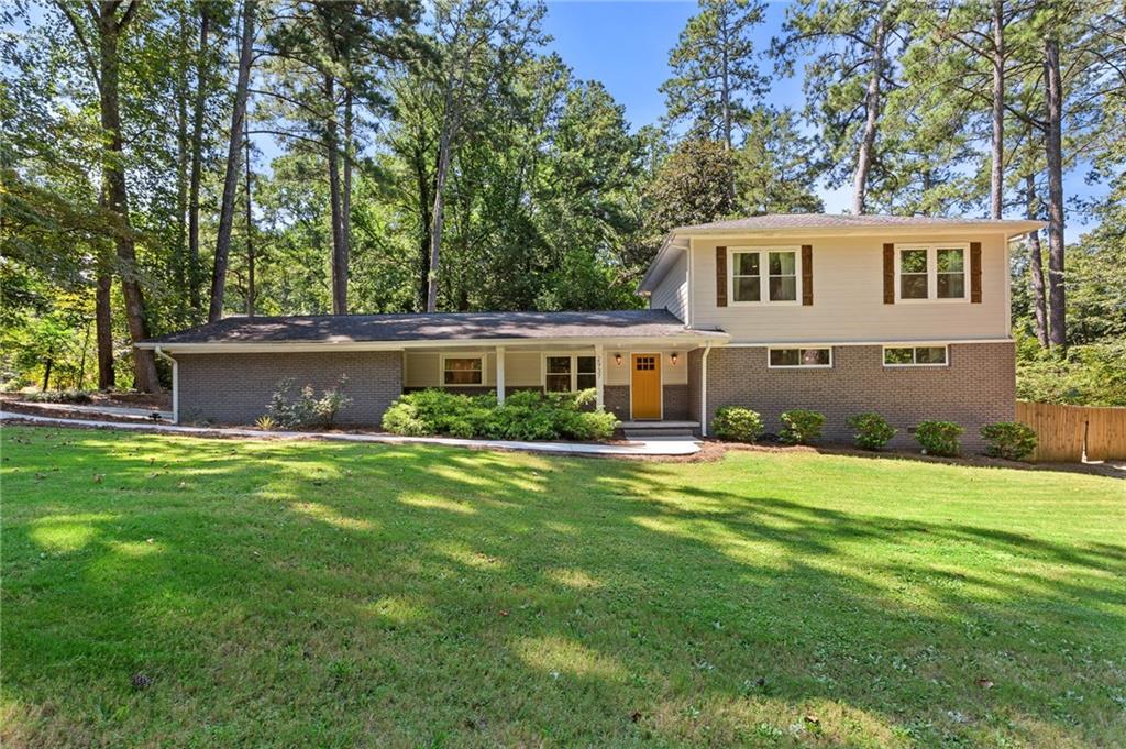 Located on a peaceful corner lot in one of Atlanta’s most sought-after, walkable neighborhoods, this 4-bedroom, 2.5-bathroom gem delivers a thoughtfully renovated living space, blending timeless charm with modern updates. Step inside to discover rich hardwood floors, a striking beamed ceiling, and a shiplap accent wall that brings texture and warmth to the great room. The fully renovated kitchen is equal parts functional and fabulous, featuring sleek quartz countertops, stainless steel appliances, a wine cooler, an island with breakfast bar, and crisp cabinetry designed for the modern lifestyle. The updated bathrooms offer spa-inspired finishes, while recessed lighting throughout the home keeps everything feeling bright and airy. Out back, the screened-in porch is a true showstopper, and with a custom wall built for your mounted TV, it's the ultimate spot for entertaining, game nights, or relaxing all year long. This quiet, tree-lined neighborhood feeds into top-rated schools and offers access to a community pool with an active swim team. Optional annual membership available. All just minutes from local parks, shopping, dining, and some of Atlanta’s most beloved attractions, including the Atlanta Botanical Gardens, Chattahoochee Nature Center, and the Georgia Aquarium. It’s the perfect balance of peaceful living and vibrant city access.