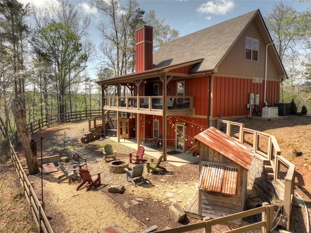 This one is right out of a magazine! This 6 year old home still looks like a New Construction home. Large lot sits privately with a beautiful Mountain View. Turn key FURNISHED-Literally just bring your tooth brush and clothes!Large Master on main level with double sink vanity, walk in tile shower, soaking tub and large closet. Open concept great room with cathedral ceilings, Beautiful fireplace with gas logs. All high end appliances in the kitchen with butcher block countertops, pantry, and island for plenty of seating. Mud room is just perfect on the main floor. Upstairs offers another master bed/bath. Basement is a perfect in law suite with a living area with fireplace and gas logs, bedroom, bathroom, bonus room and kitchenette. Everywhere you turn there is something even more beautiful than the last. Firepit, grill area and sauna are an even bigger plus to add this property. 2 car carport and work shop area. Close to gate and indoor pool. Whole house generator, tankless water heater, dual zone hvac, energy efficient.