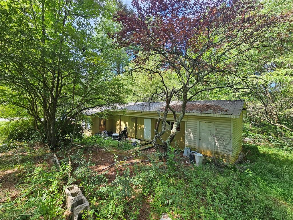 The mobile home sits on two lots, offering added privacy, expansion potential, extra outdoor space for entertaining or possibly an additional home. Don’t miss this chance to invest in a property with rare lake access and resort-style amenities. Community amenities including a boat ramp, dock access, swimming pool, tennis courts, and a playground—all just a short walk away. Whether you're into fishing, boating, or simply relaxing by the water, this property delivers it all. Cash only, this home will not qualify for any type of loan. Owner occupied, appointments only.