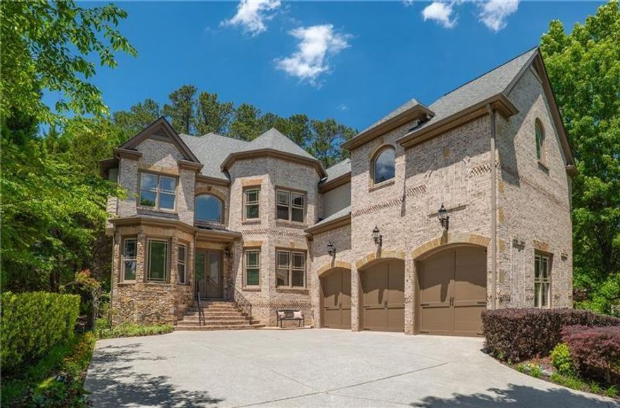 Welcome to this beautifully updated 4-sides brick home with shake and stone accents, perfectly situated in the heart of Alpharetta. Meticulously maintained by the original owners, this inviting residence offers a light-filled, open floor plan with soaring 10' ceilings on all three levels. Brazilian cherry hardwood floors, thick custom trim, and detailed millwork add warmth and elegance throughout.

The spacious kitchen flows seamlessly into the fireside keeping room, and a main-level guest suite with a separate powder room offers flexibility for visitors. Enjoy the outdoors from the private, walk-out, fenced backyard—ideal for relaxing or entertaining.

Upstairs, the expansive primary suite impresses with a fireside sitting area, generous walk-in closet, and a spa-inspired bath with a soaking tub and separate shower. Additional highlights include a three-car garage, a drop zone/mudroom, and abundant storage. Recent updates include two new HVAC systems (2018) and a water heater (2021).

The daylight terrace level features brand-new carpet, a full bath, two bedrooms, a theater, a large bonus room, and flexible spaces perfect for a home office or gym. Zoned for top-rated Dolvin ES, Autrey Mill MS, and Johns Creek HS, this home offers unmatched convenience just minutes from Avalon, Downtown Alpharetta, parks, trails, the Greenway, several private country clubs, GA-400, hospitals, Johns Creek Technology Park, and the new Johns Creek Town Center.