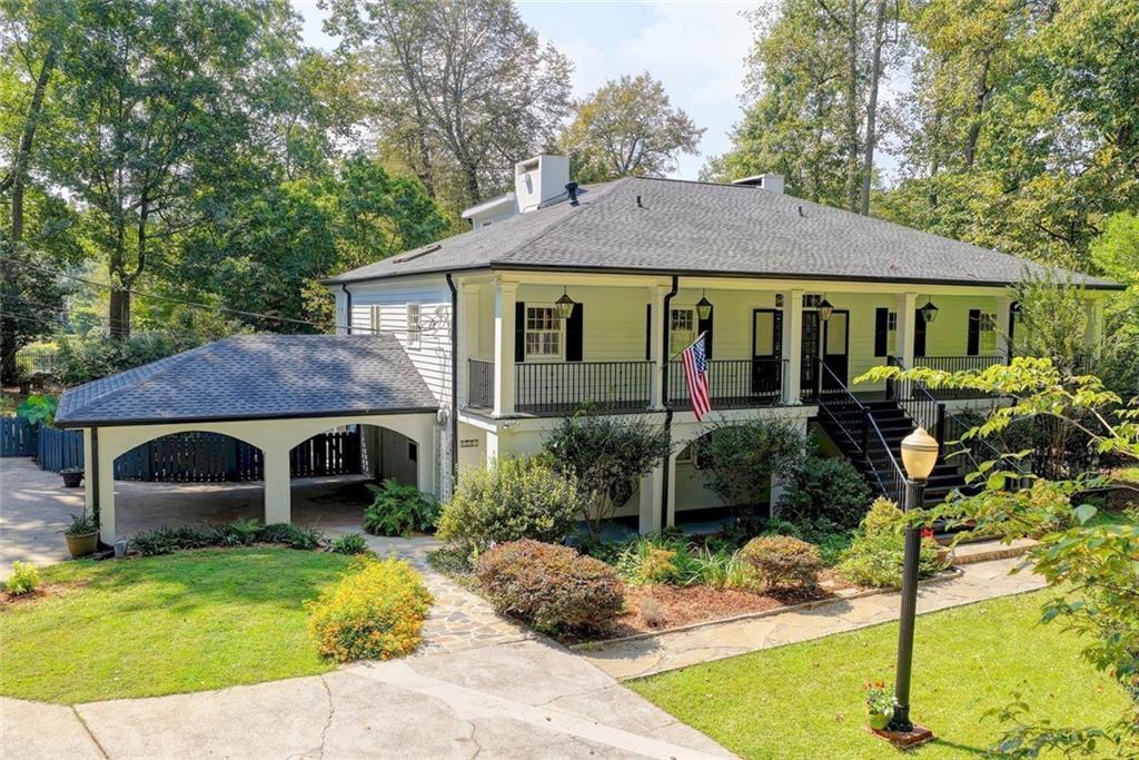 They never come on the market because no one wants to give up their home on the River, UNTIL TODAY! This 1.3 acres estate has 200 sq. feet on the Chattahoochee. That in and of itself is extraordinary, but couple that with a private dock, you can fish from or launch a kayak, a separate sitting and gathering area, a pool that runs the entire length of the home and a koi pond, all grandfathered in on the River! Your mini Tara has a rocking chair front porch that extends the length of the home. Once inside, your sun filled great room with fireplace, large dining room, and renovated kitchen that overlooks your sun room with views of the pool and Chattahoochee, make it exciting to wake up every morning. Another screened in back porch also runs the length of the home. Master on the main with working fireplace and a master closet that will be the envy of your friends. An additional bedroom on the main, perfect for visiting family and guests. Upstairs is an additional 2 bedrooms and a full bath, all with those incredible views of the River.
The finished basement has an additional bedroom and full baths, with a full finished kitchen, perfect for entertaining, or makes a great au pair or in-law suite. An additional finished room for your handyman needs or just additional storage and a laundry room with a built in dog wash. Newly painted throughout including trim, and new riverfront landings and dock. This is truly a one of a kind home, special home, situated in one of the very best areas, on a no through street. Make this one yours. Walk in attic for additional storage. NO HOA, NO SUBDIVISION.