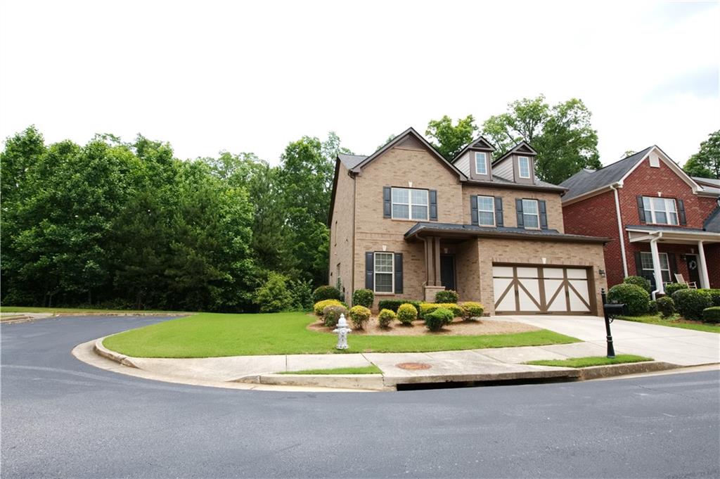 Beautiful 3 sides brick home in a gated community, cul de sac, all stainless steel appliances are one year old, new exterior paint and roof. Hardwood floor on main. Large master bedroom with his and her coat closets, plus a separated walk-in closet. Master bath features his and her vanities, garden tub & shower. Three spacious secondary bedrooms, upstairs laundry room. Completely private backyard. Unfinished basement for storage. Gated community next to the Sugarloaf Country Club. Swimming, tennis & playground. Fast & easy access to I-85, Sugarloaf Pkwy, Peachtree Industrial Blvd. Close to all shopping and restaurants. Top rated schools.