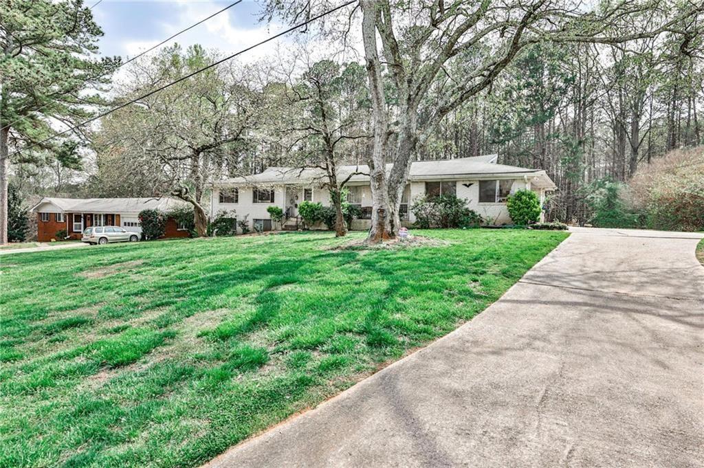 You can be the first ones to enjoy this completely renovated and refurbished ranch style brick home with a basement. The beautiful backyard backs up to Stone Mountain Park land for complete peace and quiet. So much new in this home, new kitchen floor, new quartz countertops, new dishwasher, new insulated windows, new paint, new roof, refinished real hardwood floors throughout, new levolor blinds. The laundry room is adjacent to the kitchen. The basement is ideal for a workshop or storage.