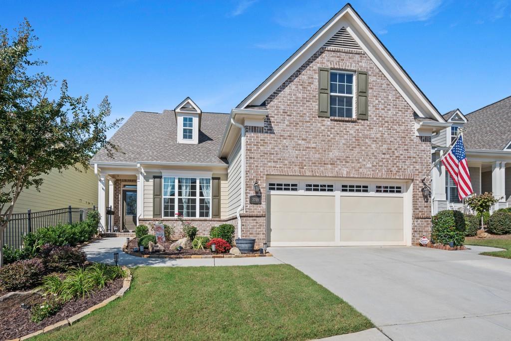 Welcome to this exceptional home nestled in a private tranquil setting and the #1 rated 55+ master planned community, Cresswind at Lake Lanier. As you stroll the walkway opening the front door, you are greeted by an open floor-plan accented by gleaming hardwood floors with views onto the expansive covered back deck. Natural light fills the spacious great room ideal for relaxation. It is flanked by a guest bedroom which may serve as private study/office. The dining area can easily seat 8 guests overlooking the outdoor area and gourmet style kitchen. The kitchen boasts custom stained cabinets, ample granite, stone countertop space, gas cooking and center island making it a cooks delight. The primary bedroom has its own hall entry way making it a private space with an ensuite spa like bathroom offering an expansive shower with custom-detailed stone and tile accents and extended double vanity. A third bedroom with an adjacent full bath and a generous sized laundry room are situated on the main floor. The lower level of this home is incredible! A true custom-build with fine finishes and features provides a second home family and guests. The entry foyer welcomes you into the bright kitchen accented with a light on-trend color palate overlooking the living room, dining area and a true outdoor oasis! The primary bedroom has an enormous walk-in closet and elegant spa like full bath. A lovely laundry room and plenty of additional storage make this an ideal multi-generational living area. The garden-like outdoor entertainment space abounds with an oversized covered deck ideal for dinner parties and family gatherings. The lush, landscaped garden area is a butterfly and birdwatchers paradise. On cool evenings the firepit awaits for cozy gatherings. Stone walkways, 2 private gated entries and a panoramic view of wooded greenspace provides ultimate privacy and a sense of serenity. The backyard is a true paradise one of the finest you will see. This immaculate 4 bedroom, 3 full bath home with its fine appointments is sure to impress. It is more than a home, it is a lifestyle. The 40,000 + sq. foot clubhouse is bustling with activities/events daily. Offering more than 100 clubs, a best-in-class gym, indoor Olympic pool, numerous arts, crafts, fitness classes, billiards, games and more. There is an outdoor resort style pool, outdoor fireplace and park-like lawn for concerts, dancing and more. Tennis, pickleball, kayaking, boating area, common garden, walking trails, and the pooch patch for those furry family members all make for fantastic outdoor fun. The property manager and full-time activities director are dedicated to managing the facility, and its events beyond expectations. Gainesville offers some of the finest health care specialists in the southeast and are just minutes away. Lake Lanier boating, its marinas are the backdrop to a relaxing lifestyle that awaits you. Cresswind at Lake Lanier is simply the best master planned active adult community in Georgia.
