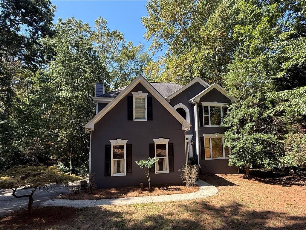 JUST STEPS to Lake Lanier! LOCATION! LOCATION! LOCATION! Affordable Lake Living!! Minutes from Lake Lanier’s parks, marinas, and outdoor adventures. NO HOA!! Opportunity knocks for a Savvy Investor or Buyer looking for some sweat equity. Two-story 3BR/2.5BA home on PRIVATE .59 Acres but feels like much more. Don't miss out on this exceptional opportunity to make your mark on a property primed for transformation. Overlooks a private backyard with tons of wildlife. Huge Master Suite & Retreat upstairs. Finished Basement with a half Bath could be converted to Full Bath making 4th Bedroom in Basement. Excellent Forsyth County schools & in East Forsyth High School district. AS-IS Sale, needs some deck work & Driveway needs repair. Hardcoat stucco in good shape. Schedule your Appt today!