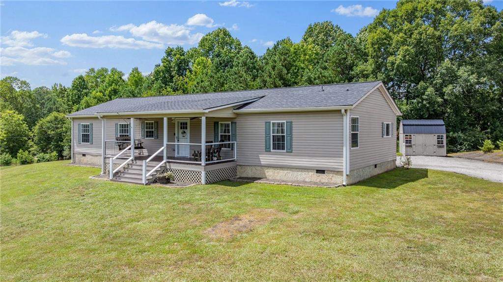 Welcome to easy one level living on a beautiful 1.75 acre private lot with no HOA. This open and roomy home features a large kitchen, a split bedroom plan, and a charming farmhouse interior. You’ll love the brand new concrete driveway that was just poured, along with two oversized decks that offer peaceful views, perfect for morning coffee or watching the deer wander by. All of this just minutes from Lake Lanier, Alberta Banks Park, shopping, and local restaurants. Enjoy the best of both worlds with a quiet country feel and everyday conveniences close by!
