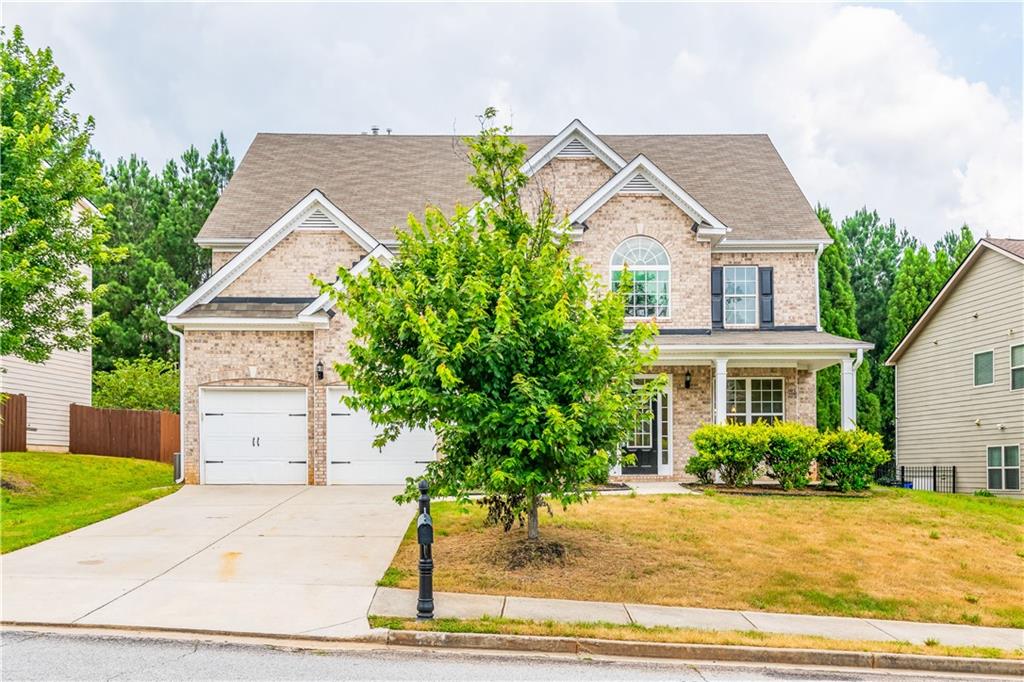 Exceptional 3-Story Home in Southwind Golf & Tennis Community! Recently renovated with brand-new stainless steel appliances, new carpet, and fresh paint throughout. Features an open-concept layout with a spacious kitchen, granite countertops, large island, and coffered-ceiling dining room perfect for entertaining. The private upstairs master suite includes dual stairwell entries, a sitting area, and a large walk-in closet. The third-floor bonus space is a showstopper ideal for a home theater and complete with a projector, plus 2 additional rooms and a full bath. Enjoy the covered back porch and beautiful backyard, ready for your personal touch. This home offers space, style, and comfort in one of the area's premier communities! Don't miss your opportunity to make it yours!