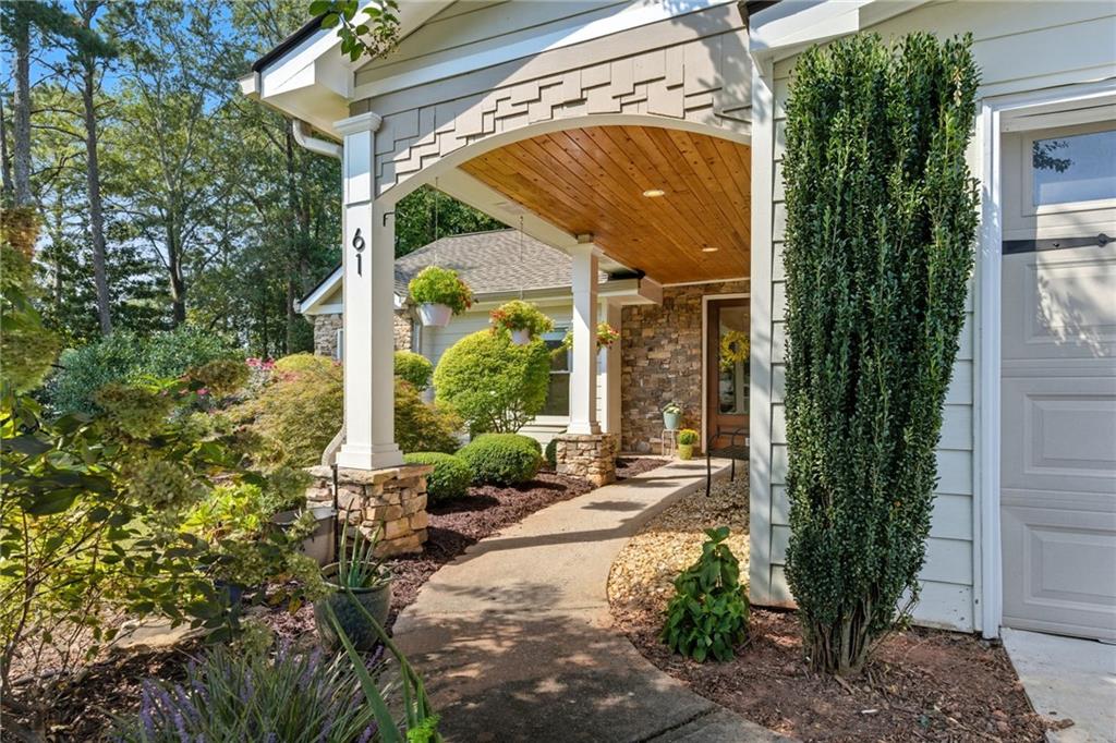 What a gem! This home is a rare step-less ranch in East Cobb! The covered front walkway and beautiful glass front door welcome you into this stunning home. Once inside, you'll immediately fall in love with the dark hardwood floors, soaring 10+ ft. ceilings, and unique archways. The layout flows beautifully and is an entertainer's dream. The oversized Great Room features a gas fireplace, recessed lighting, and two sets of French doors that lead to the Bonus/Flex room and the large, flat fenced-in backyard. The updated, open-concept kitchen overlooks the Great Room and has granite countertops with stainless steel appliances and under-cabinet lighting. Just off the kitchen, you'll find the separate Dining Room. The private Primary Suite features 2 closets and a BRAND NEW bathroom with double vanity and walk-in shower. There are 2 additional bedrooms located down a separate hallway with another BRAND NEW full bathroom and an updated half bath. The home also has a 2-year old roof, new water heater, and loads of other tasteful upgrades. The only thing missing is you! The home is located on an almost half-acre lot with a fully-fenced, level backyard and a long driveway with 2-car garage and additional parking. Don’t miss this rare East Cobb beauty!