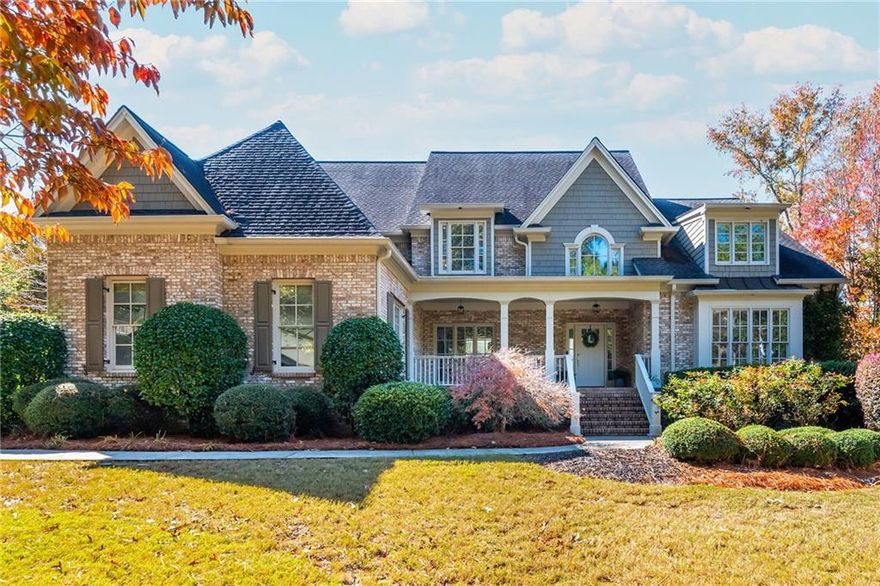 Perfectly positioned between downtown Alpharetta and downtown Milton, this luxurious five-bedroom home offers timeless elegance, modern updates, and serene surroundings. A stately front porch welcomes you with views of the wooded front yard, setting the tone for the home's charm and sophistication. Inside, you'll find a newly remodeled kitchen featuring high-end appliances and designer finishes, seamlessly flowing into open living and dining spaces-perfect for entertaining. On the main level the spacious primary suite impresses with a fully renovated spa-style bath, while fresh paint throughout gives the home a crisp, move-in-ready feel. Fully finished basement offers an exceptional blend of comfort, functionality, and style. Featuring a custom-built bar and an elegant temperature-controlled wine cellar. This lower level also includes spacious exercise room, a billiards area, and a private office or guest room with a private full bathroom. With a level walkout providing easy access to the backyard, this basement seamlessly extends the home's living space and outdoor enjoyment. Step outside to your private backyard oasis, where a sparkling pool is beautifully framed by mature trees, offering both privacy and tranquility. Enjoy luxury, comfort and convenience-all within minutes of the area's best dining, shopping, and schools.