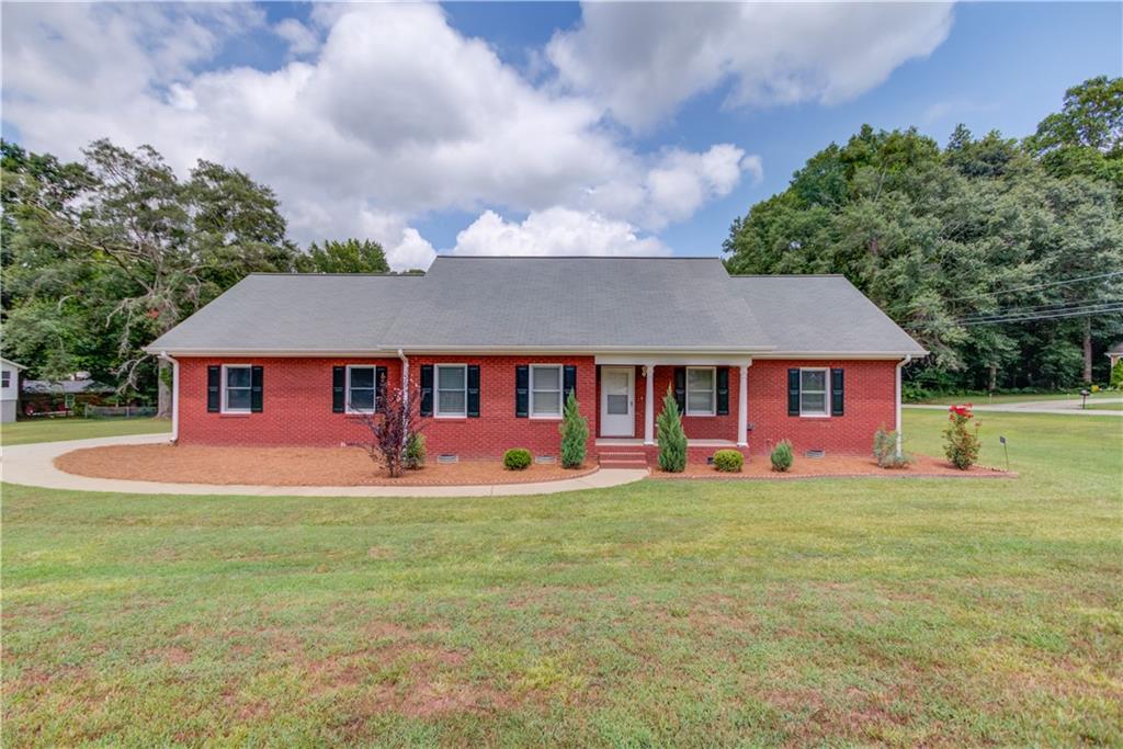 Brick ranch with level lot close to all the City of Winder has to offer! This remodeled ranch is super clean with tons of storage. Large master bedroom with walk-in closet, open living room, with extra rooms for bedroom suite, office, playroom, or many other options. New flooring, paint, HVAC and more! With fixed attic stairs, the 2nd level attic is above the main garage and unfinished for storage that could be easily finished for additional living space, office, media or hangout room. Bring your tools and toys...the property also features a large detached 30'x24' 2 car garage with new roof and a 2nd level. Optimal for a shop, parking, boat or trailer storage! The 2nd level could be finished for additional living space with a huge amount of potential for a variety of uses!
Nice and level corner lot with space to roam yet still close to quaint downtown restaurants, shops, and parks.
Professional photos coming soon! HVAC and garage roof being replaced!