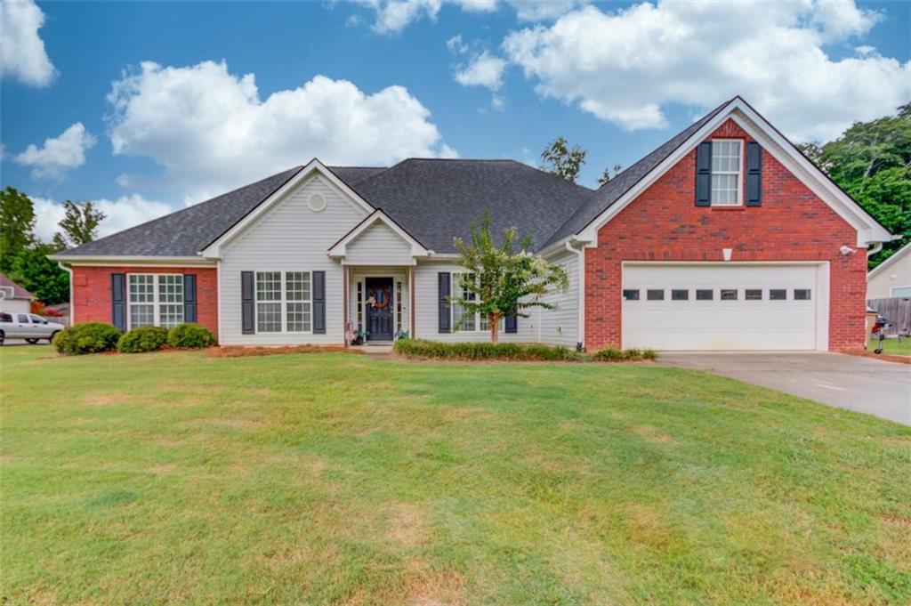 Beautifully maintained 4 bedrooms, 2.5 bathroom ranch home. This home offers an additional office room with French doors, new paint in the main floor bedrooms, bathrooms, and laundry room, LVP flooring in common areas, formal dining room, custom travertine tile backsplash and granite countertops in the large kitchen that also has an elevated countertop bar and large eat-in area. Outside you will find a recent upgraded oversized covered back patio overlooking a wonderfully sized backyard, ready for you to make it your own oasis. The front yard is also a great size with plenty of driveway space. Located in a small, no HOA, subdivision that is highly sought after within minutes to I-85, yet nestled away from interstate traffic and noise.