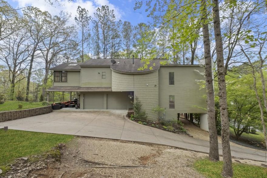 Own your own architectural sanctuary home in the Walton High School district! This unique home in Lake Fjord sits on a beautiful corner lot, offering tranquility, and panoramic views. Inside, enjoy gorgeous oak and Brazilian cherry floors, Turkish porcelain tiles, and soaring ceilings with abundant natural light. The great room features a vaulted ceiling with exposed beams, and a wood-burning fireplace. The adjacent dining room overlooks the great room and connects to a large screened-in porch. The gourmet kitchen boasts Sub-Zero and Jenn-Air appliances, a double oven, warming drawer, island seating, and a breakfast nook with a barn wood accent wall. Upstairs, the spacious primary suite has a sitting room,two large walk-in closets, and private access to its own cedar hot tub room. The bathroom has a free standing Oceania deep soaking tub, dual vanities, and a separate shower. Two additional bedrooms, a full bath, and a large laundry room complete the upper level. The finished terrace level includes a finished bedroom, full bath, and a recreation/family room with exterior entry and parking perfect for an in-law or au pair suite. The backyard is cleared, leveled, and landscaped, ready for playtime. Don't miss the virtual tour!