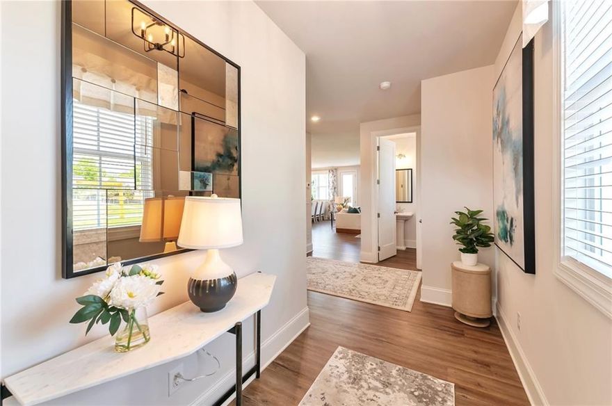 The Cherokee floor plan perfectly blends style and functionality, featuring an open-concept design ideal for modern living. Large windows, luxury plank flooring, and soaring 9-foot ceilings fill the home with natural light and create a warm, inviting atmosphere. The chef-inspired kitchen showcases elegant granite countertops, a stylish tiled backsplash, Whirlpool appliances, and a spacious center island—perfect for meal prep and entertaining. Relax in the primary suite, where comfort meets tranquility, complete with a luxurious shower, dual vanities, and a generously sized walk-in closet. Two additional bedrooms offer ample closet space and share a full bath with a double vanity. Step outside to your backyard patio and take in the breathtaking mountain views. Residents of this vibrant community enjoy access to fantastic amenities, including a swimming pool, tennis court, and clubhouse. With lawn maintenance included in the HOA, you’ll have more time to relax and enjoy everything your new neighborhood has to offer. Combining modern design with the natural beauty of its surroundings, the Cherokee floor plan is truly the perfect place to call home. Photos are for illustrative purposes and represent the floor plan.