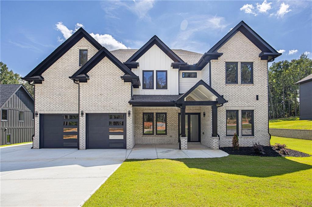 Welcome to Luxury Living in Auburn, Georgia! This brand-new 5 bedroom, 4.5 bath home offers elegance, comfort, and convenience in one of Auburn’s most beautiful and fast-growing communities. Step inside to an open-concept floor plan that flows seamlessly from the chef-inspired kitchen into the spacious living and dining areas—perfect for entertaining or everyday living. The main level features a private guest bedroom with full bath off the garage entry, a convenient mudroom, and a dedicated home office just beyond the foyer. Upstairs, the expansive owner’s suite boasts a luxurious master bath and walk-in closet, while additional generously sized bedrooms each include their own private bath for comfort and privacy. Designed with modern finishes and thoughtful details throughout, this home sits on a solid slab foundation for lasting quality. A built-in sprinkler system provides easy lawn care, enhancing year-round curb appeal. Nestled in one of Auburn’s most beautiful and fast-growing communities, this home delivers style, space, and convenience in a prime location.