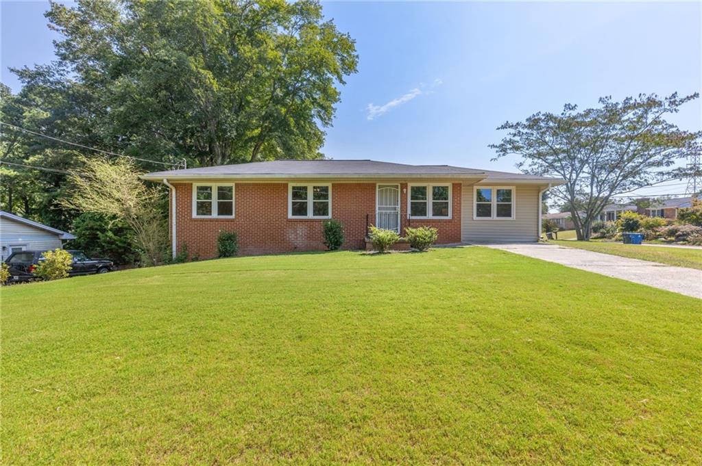 This updated ranch sits on a picturesque corner lot less than a mile from downtown Kennesaw and just 2 miles from KSU campus. Inside, you’ll find real hardwood floors throughout and a bright living area that flows into the kitchen with white cabinetry and new stainless steel appliances.
The main level offers 3 bedrooms plus a spacious bonus room—ideal as a 4th bedroom, great room, or flex space to fit your needs. The level, freshly sodded yard provides plenty of room for pets, play, or outdoor gatherings. A full basement adds storage and potential for future expansion.
Recent improvements include newer windows, roof, and HVAC system, making this home truly move-in ready. Whether you’re looking for an investment property, a student home, or simply a well-located residence, this one checks all the boxes. Easy access to Kennesaw amenities, hospitals, KSU, and I-75.