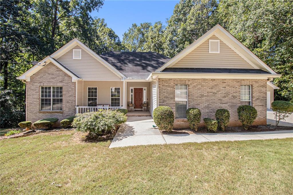 Welcome to this beautifully maintained ranch home nestled on a quiet, private, wooded cul-de-sac lot. From the moment you arrive, the inviting rocking chair front porch and timeless curb appeal will captivate you! As you pull up, you’ll notice the detached 2-car garage plus an additional outbuilding—perfect for all your toys, RV, boats, motorcycles, or extra vehicles. A true dream for hobbyists and collectors! Step inside to discover gorgeous LVP flooring throughout, an open-concept floor plan, and a spacious family room with soaring cathedral ceilings. The chef’s eat-in kitchen boasts custom cherry cabinetry, granite counters, stainless steel appliances, and ample storage. With a seamless view to the family room and dining area, entertaining guests is effortless and enjoyable. Enjoy peaceful mornings on your back deck overlooking the private, wooded backyard, complete with an additional storage building—ideal for both relaxation and functionality. The oversized master suite offers a sitting area, cathedral ceiling, updated spa-like bath with a custom tile shower & bench, soaking tub, new vanity, and a generous walk-in closet. Two additional bedrooms and a full bath complete the main level, ensuring space and comfort for everyone. Downstairs, the full finished basement is an entertainer’s paradise! Featuring a large recreation/living area, a fourth bedroom, full bath, second full kitchen, and flex space—this level is perfect for an in-law suite, man cave, or the ultimate hosting retreat! This home truly has it all and must be SEEN to be fully appreciated! Don’t miss your chance to own this one-of-a-kind property. Make this DREAM home your REALITY today and schedule your showing!