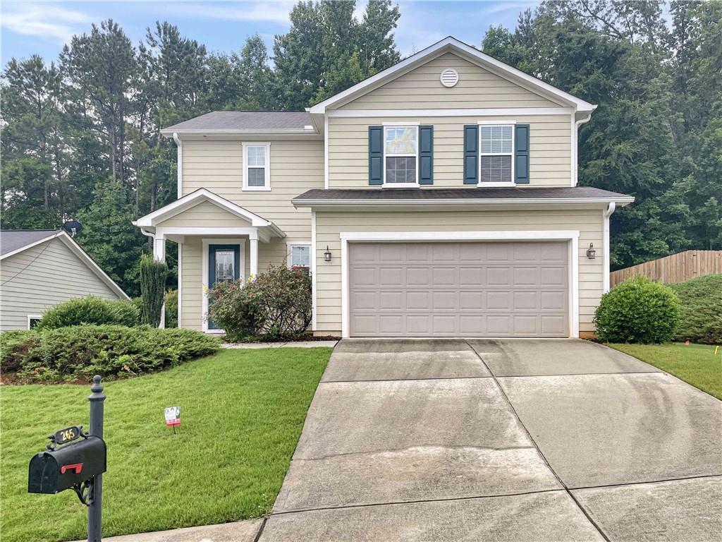 Terrific 3BR / 2.5BA Woodstock home in popular Wynchase subdiv with Swim/Tennis. Main lvl w/hdwd flrs throughout. Open plan w/large Family Rm that is open to Dining Area and Kitchen. Separate built-in planning desk / buffet counter, Kitchen w/Bkfst Bar, Island, SS appliances, Granite and lots of cabinets / counters. Pantry closet and 2-Car Garage access off the Kitchen. Upstairs hallway w/lg built in desk / work area. Master BR / Master BA w/lg walk-in closet, dbl vanities, sep shwr and garden tub. Walk-in Laundry Rm, Hall BA and 2 Guest BR's upstairs too. Covered rear patio and level rear yard.