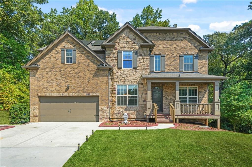 If you’ve been searching for a Move-in Ready home that offers size, convenience, and flexibility, this is it. Built in 2019, this immaculate 7-bedroom, 4-bathroom beauty located in the Wolf Creek Chase neighborhood is what you've been waiting for. Step inside the impressive two-story foyer and you’re immediately greeted by gleaming Engineered hardwood floors, den or home office, and a dining room with coffered ceilings and elegant trim details. The gourmet kitchen with granite counters, has sleek white cabinetry, a bold backsplash, stainless steel appliances, and double ovens. It opens directly to the family room, where a cozy fireplace and built-ins make the perfect backdrop for gatherings. Upstairs, the oversized primary suite feels like a private retreat. Enjoy a fireside sitting area, spa-inspired bath with a soaking tub and walk-in shower, dual vanities, and an expansive closet. Secondary bedrooms are spacious and versatile, with plenty of room for guests, kids, or a home office.
Just wait until you see the fully finished basement with its own kitchen, living space, laundry room, additional 2 bedrooms, and private entry. Perfect for multigenerational living, an in-law suite, or even rental income potential.
Out back, a large deck overlooks your private wooded yard ideal for entertaining, grilling, or simply relaxing. All of this is set in a vibrant clubhouse community zoned for the highly sought-after Westlake School District.
Conveniently located minutes from the Wolf Creek Amphitheater, Wolf Creek Golf Course, Camp Creek Marketplace, Hartsfield-Jackson Airport, and major highways. You’ll enjoy easy access to shopping, dining, and downtown Atlanta.
This rare find combines beauty, space, and practicality in one perfect package. Don’t miss your chance. Schedule your tour today!