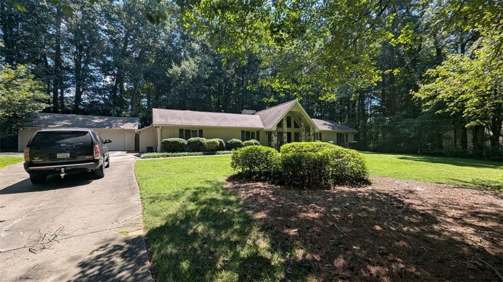 Amazing Opportunity in Prime Alpharetta Location! Discover the potential of this .68± acre level lot, perfectly situated just minutes from major highways, Downtown Alpharetta, Milton, parks, shopping, and top-rated dining. Zoned R15 with utilities available, this property offers endless possibilities for builders or owner-occupants ready to create their dream home. While the existing home could be renovated, the true value lies in building a spectacular new residence tailored to your vision. Bring your architect and designer—opportunities like this are rare in such a highly desirable area. Be sure to review recent sales of lots and new construction nearby to fully appreciate the value this property presents.