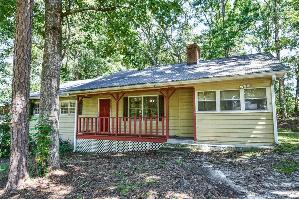 Nestled on a serene wooded lot in a quiet and welcoming neighborhood just outside of Gainesville, 4850 Forest Blvd offers the perfect blend of charm and functionality. This inviting 3-bedroom, 2-bath ranch-style home features an open floor plan with a spacious kitchen, cozy wood-burning stove, and laminate flooring throughout. Enjoy peaceful mornings on the screened-in porch just off the kitchen, or unwind on the front porch and back patio. With ample parking, no HOA, and a quiet, well-established neighborhood, this 1,344 sq ft residence is ideal for those seeking comfort and convenience. Built in 1979 and set on nearly half an acre, it's a true gem waiting to be discovered. Schedule a showing today!