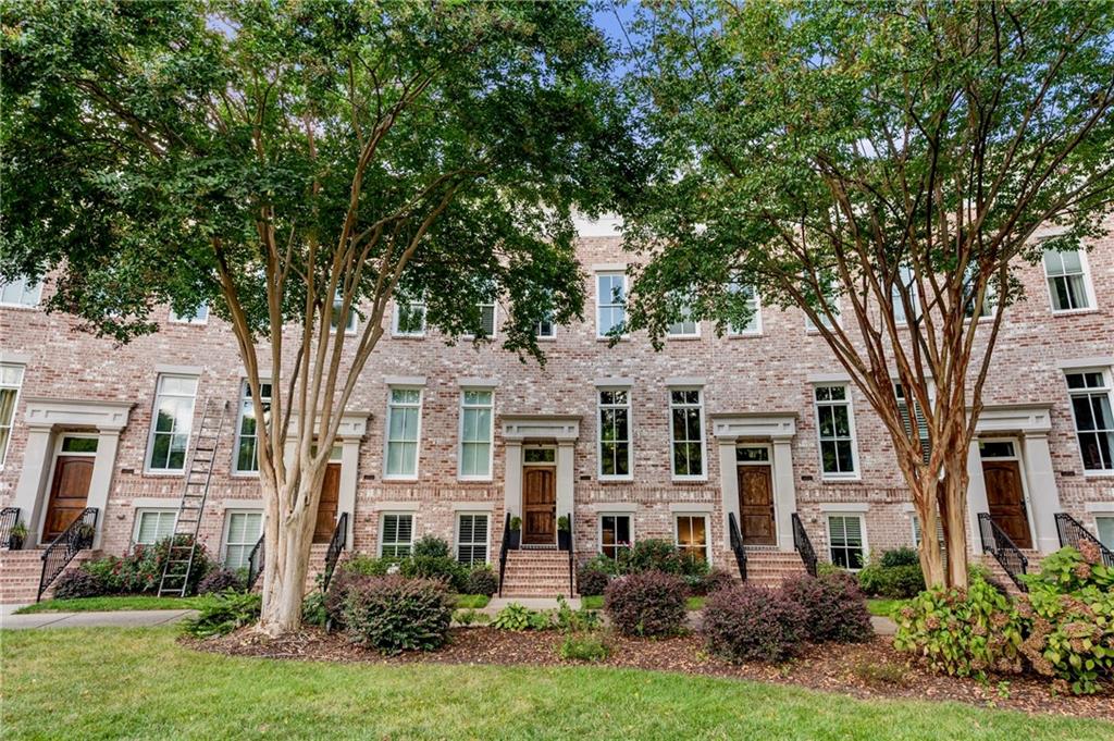 Dreaming of walkability? Welcome to 226 Inman Lane NE, a classic brick townhome set in one of Atlanta’s most desirable BeltLine communities—with a Walk Score of 92 and direct access to Krog Street Market, Barcelona, the Eastside Trail, and more.
Tucked along a peaceful, landscaped courtyard, this 3 bed / 3.5 bath home offers open, airy living across three levels. Inside, you’ll find hardwood floors, tall ceilings, and sun-splashed spaces ideal for relaxing or entertaining. The open floor plan flows from living to dining to kitchen with ease—perfect for hosting or keeping it casual.
Step outside to your private back deck—ideal for lounging, container gardening, or weekend brunch in the treetops. Upstairs, the king-sized primary suite features a spa bath with soaking tub, separate shower, dual vanities, and a generous walk-in closet. A second ensuite bedroom upstairs adds flexibility, while the third bedroom suite on the terrace level offers privacy for guests or the perfect home office.
The oversized 2-car garage fits SUVs, plus guest parking is just steps away. As part of the Inman Park Village community, enjoy exclusive access to the resort-style pool, fireplace lounge, and manicured central courtyard—a rare oasis in the city.
With unmatched location, classic design, and instant access to the BeltLine, this is intown Atlanta at its very best.