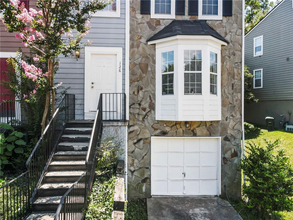 Prime Location in Marietta!
This beautifully located townhome is just of Bells ferry Road, with quick access to I-75, to shopping centers, supermarkets, enjoy the dinning experience and entertainment options of Barrett Pkwy. Offering 3 bedrooms , two full bathrooms and a convenient half bath on the main level, this 1462 sq, ft. home also includes a 1-car garage and plenty of storage space.
The kitchen feature white cabinets and solid stone countertops . A dedicated laundry room is located upstairs for added convenience. With NO HOA restrictions, this property can either be use as owner-occupant or investors looking to rent and build equity.