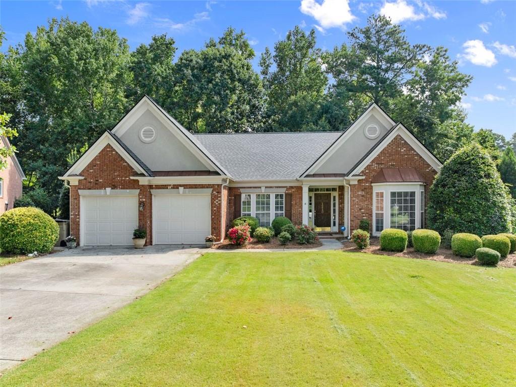 Discover this beautifully updated stepless ranch in the sought-after Commons section of Longlake! Located on a quiet cul-de-sac, this home sits on one of the neighborhood’s larger, flat, fenced lots backing to a peaceful creek. Inside, you’ll find new LVP flooring throughout most of the home, Nest thermostats, and a stunning kitchen featuring a beautiful island, walk-in pantry, and Electrolux appliances including a wall double oven and gas cooktop—perfect for everyday living and entertaining. The spacious family room offers an updated fireplace surround for cozy evenings at home. The master suite includes a walk-in closet with built-ins and a spa-like bath with Italian tile flooring. Step outside to a deck built to easily screen in for year-round enjoyment. A new roof adds peace of mind and lasting value. Enjoy Longlake’s incredible lifestyle with a 45-acre lake, clubhouse, pool, tennis and pickleball courts, playground, and active swim, tennis, and pickleball teams—all in one of Forsyth County’s most desirable communities!
